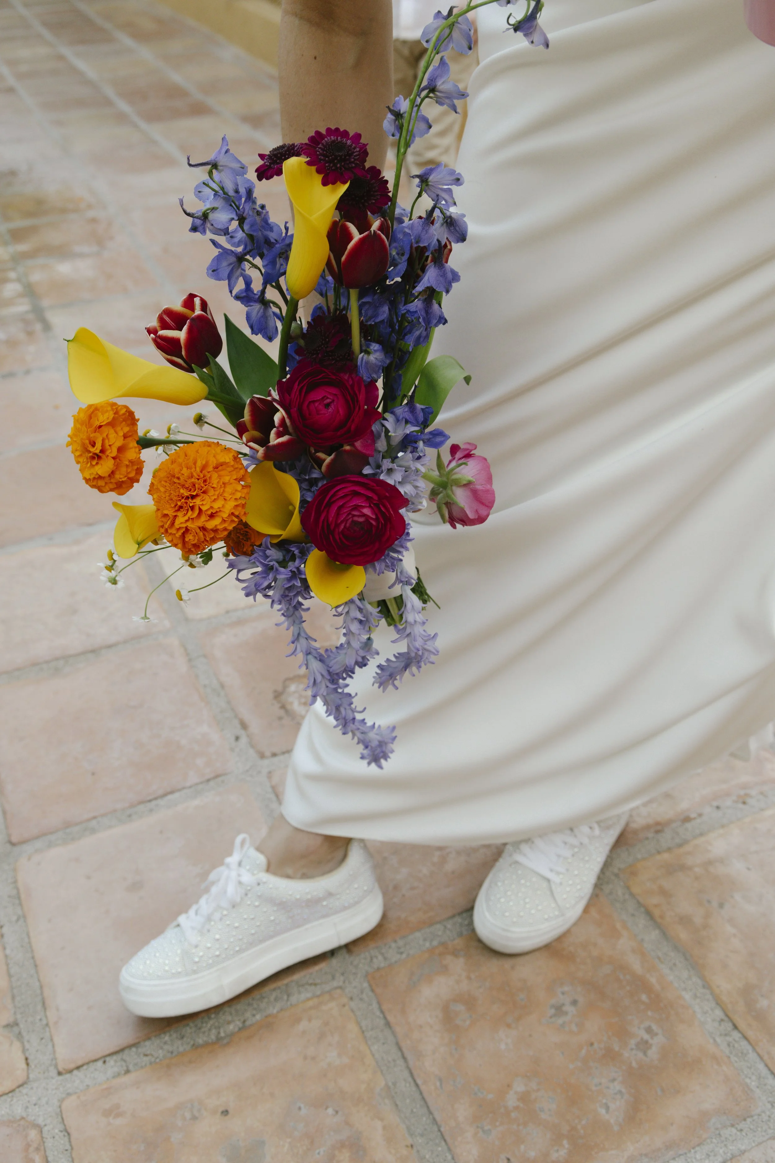 Romantic newlywed portraits from Chelsea and Travis' intimate Sedona, Arizona elopement, featuring elegant courtyard portraits, candid moments with their beloved dog, and timeless wedding photography captured after their private ceremony before golde