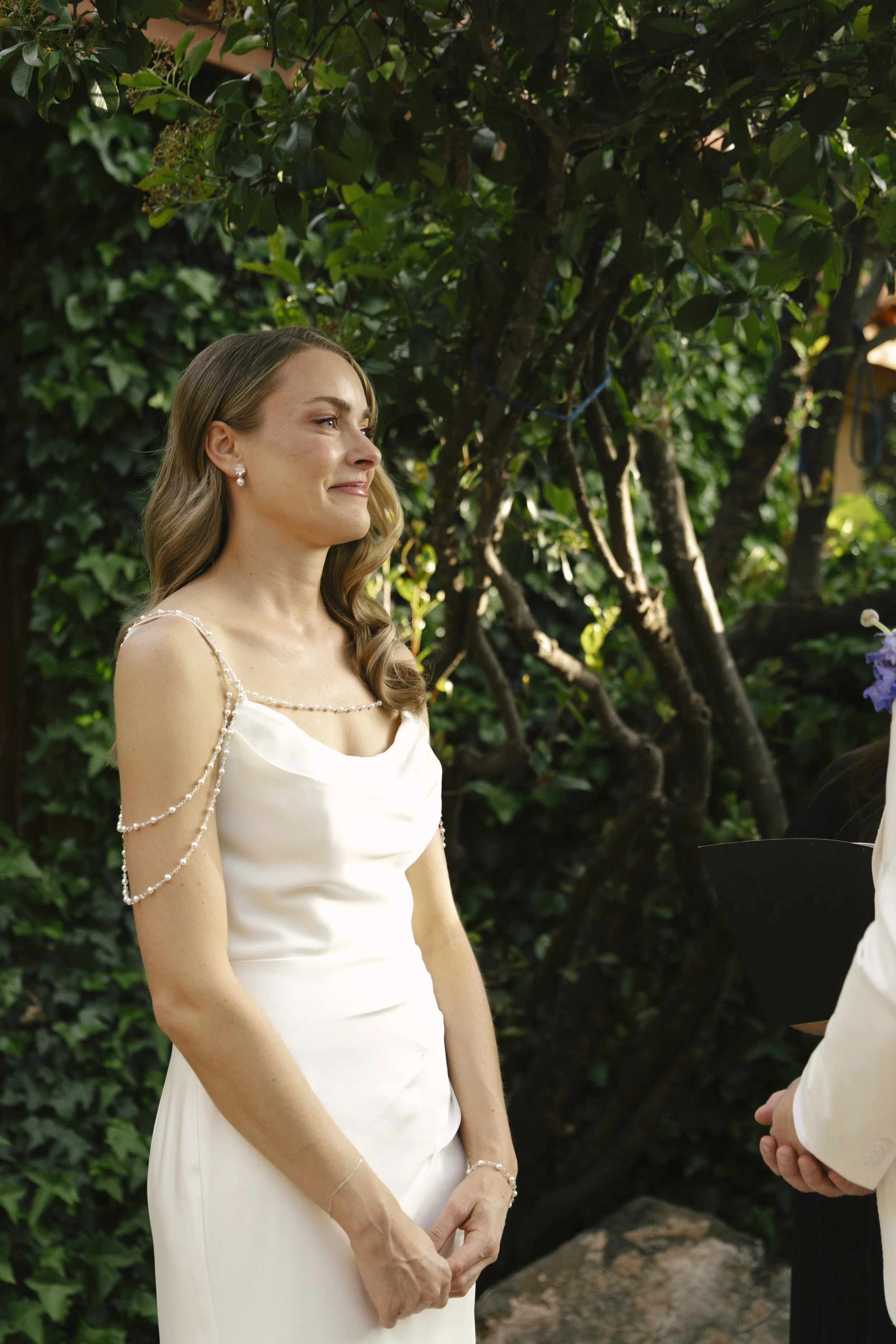 Chelsea and Travis exchanged heartfelt vows during their intimate Sedona elopement at a private Arizona home, surrounded by their closest family, friends, and beloved dog. Their outdoor ceremony was filled with meaningful moments, personal vows, and 