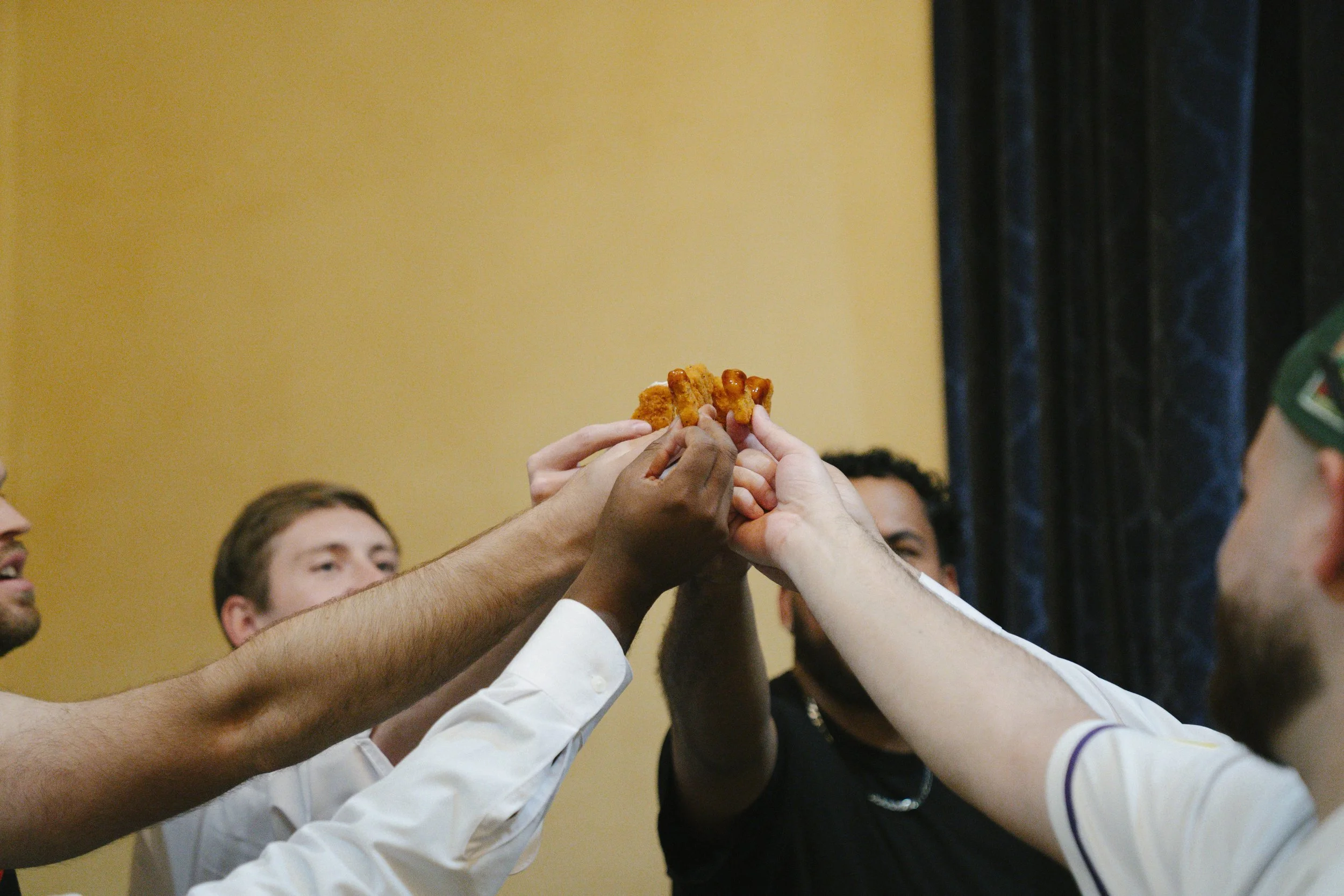 The groom’s getting-ready moments at Ashley Castle in Chandler, Arizona, capture the energy and anticipation of the wedding day, documented through hybrid film and digital photography to preserve both candid emotion and timeless detail inside this el