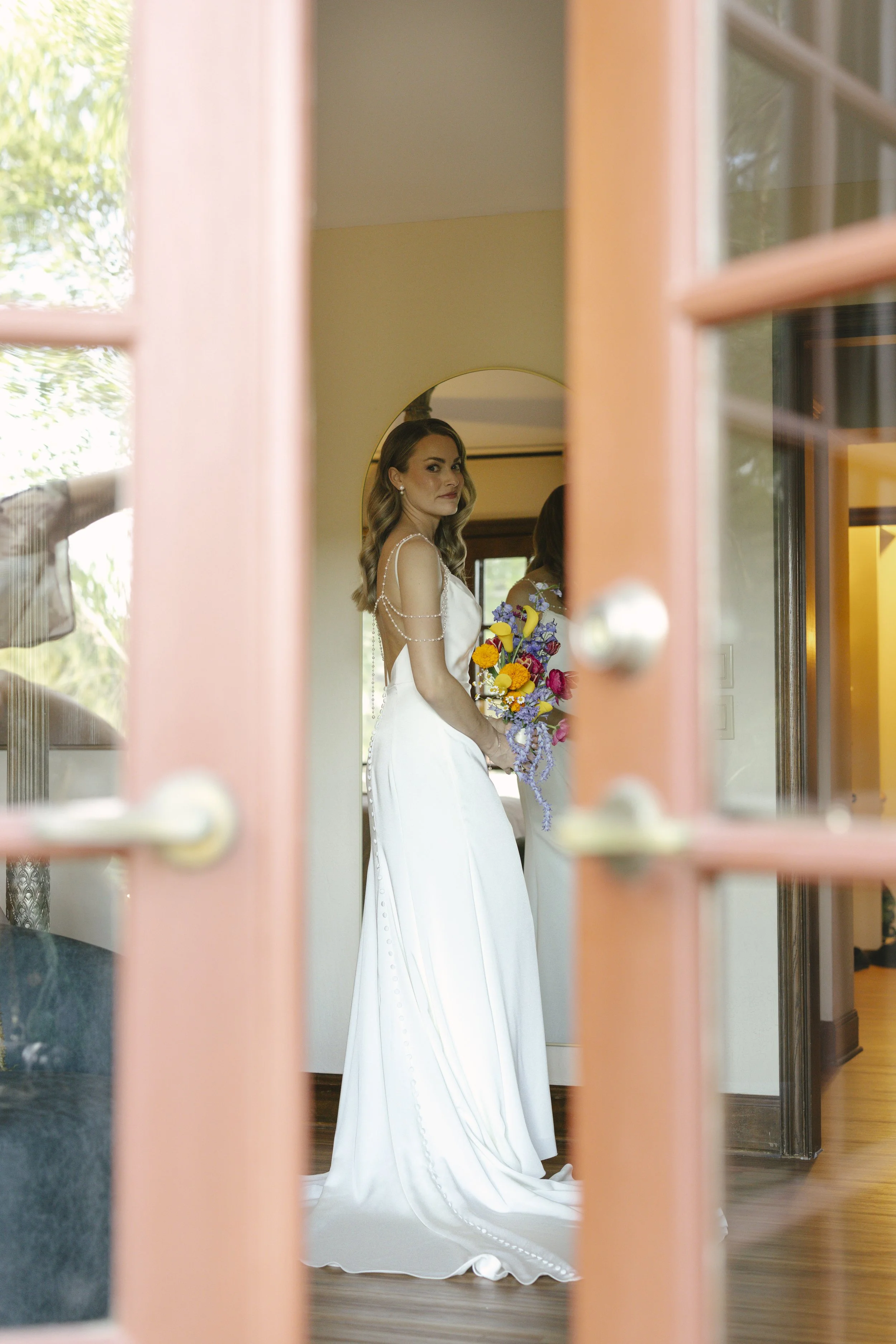 Chelsea and Travis' intimate Sedona elopement continued with heartfelt bridal getting-ready moments as the bride shared meaningful time with her mother and closest loved ones. From fastening her wedding dress and adding the finishing touches to quiet