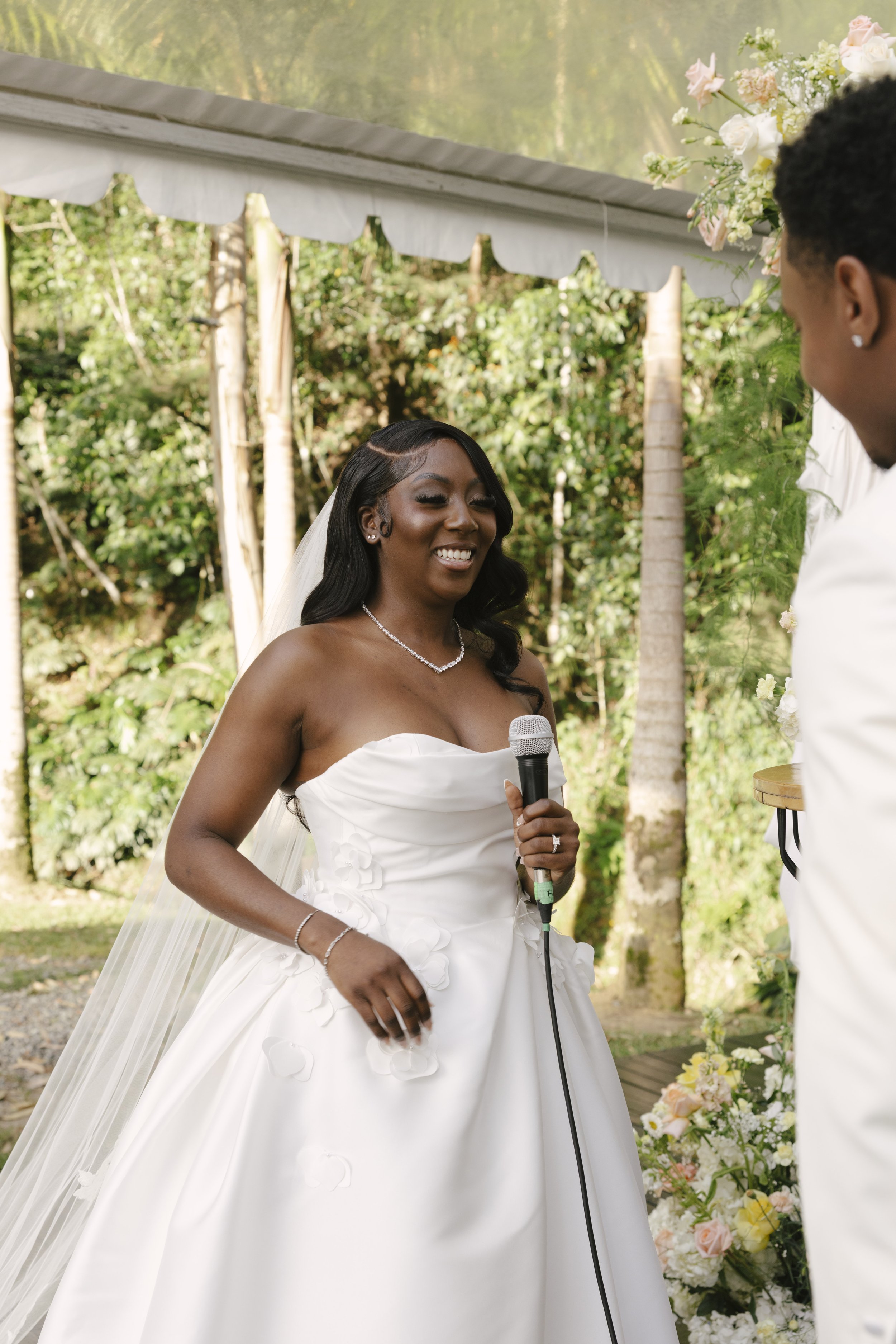 Forest Campestre wedding ceremony in Medellín, Colombia featuring the bridal processional, groom's reaction, emotional ceremony moments, floral aisle design, wedding guests, and documentary-style wedding photography