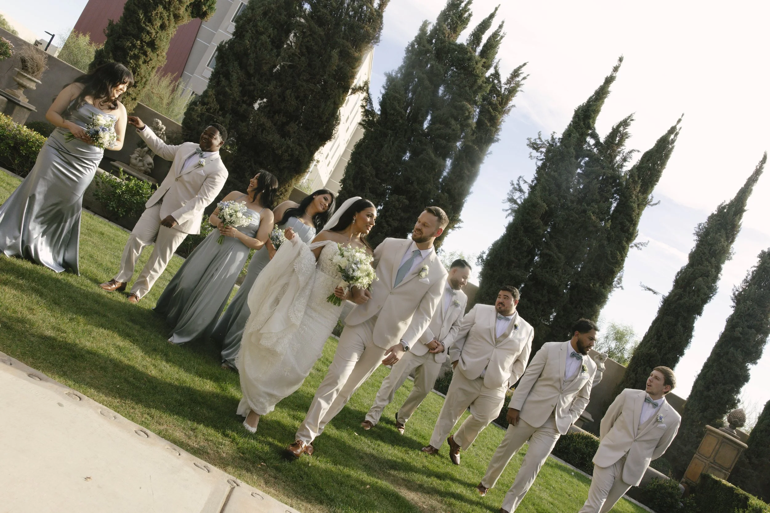 The bridal party portraits at Ashley Castle in Chandler, Arizona, brought playful energy and celebration to the day, with hybrid film and digital photography capturing candid laughter, stylish group moments, and unforgettable memories with the bride,