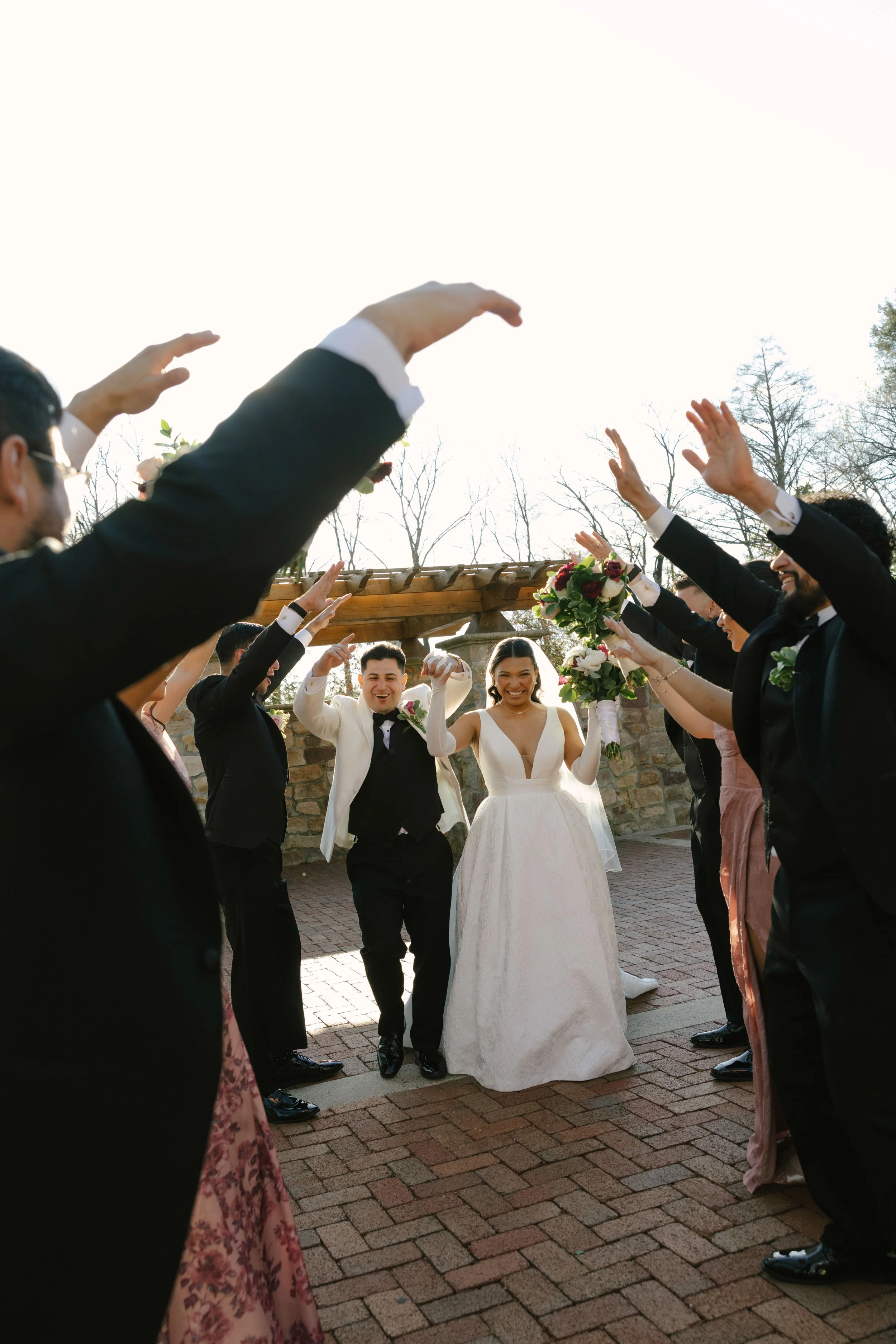 Bridal party portraits at Hotel DuVillage celebrate the bride and groom alongside their closest friends and family. Captured on digital and 35mm film, these images highlight genuine laughter, timeless portraits, and unforgettable moments.