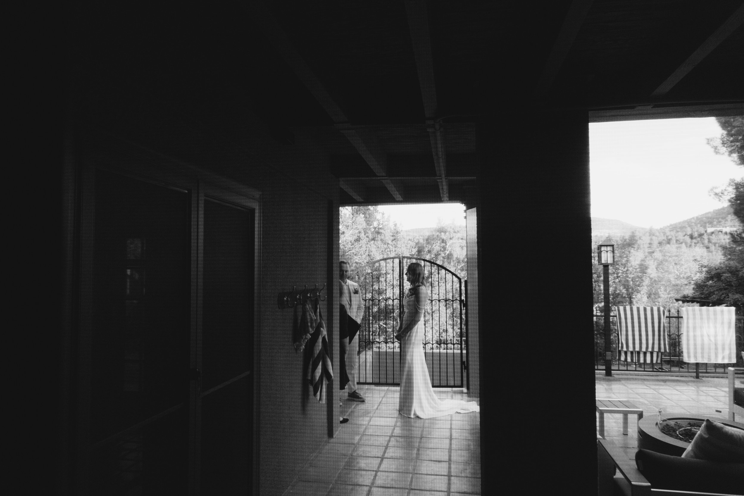 Chelsea and Travis shared an intimate first look surrounded by the natural beauty of Sedona before exchanging vows during their private Arizona elopement ceremony. Set along a peaceful garden path, these heartfelt moments marked the beginning of thei