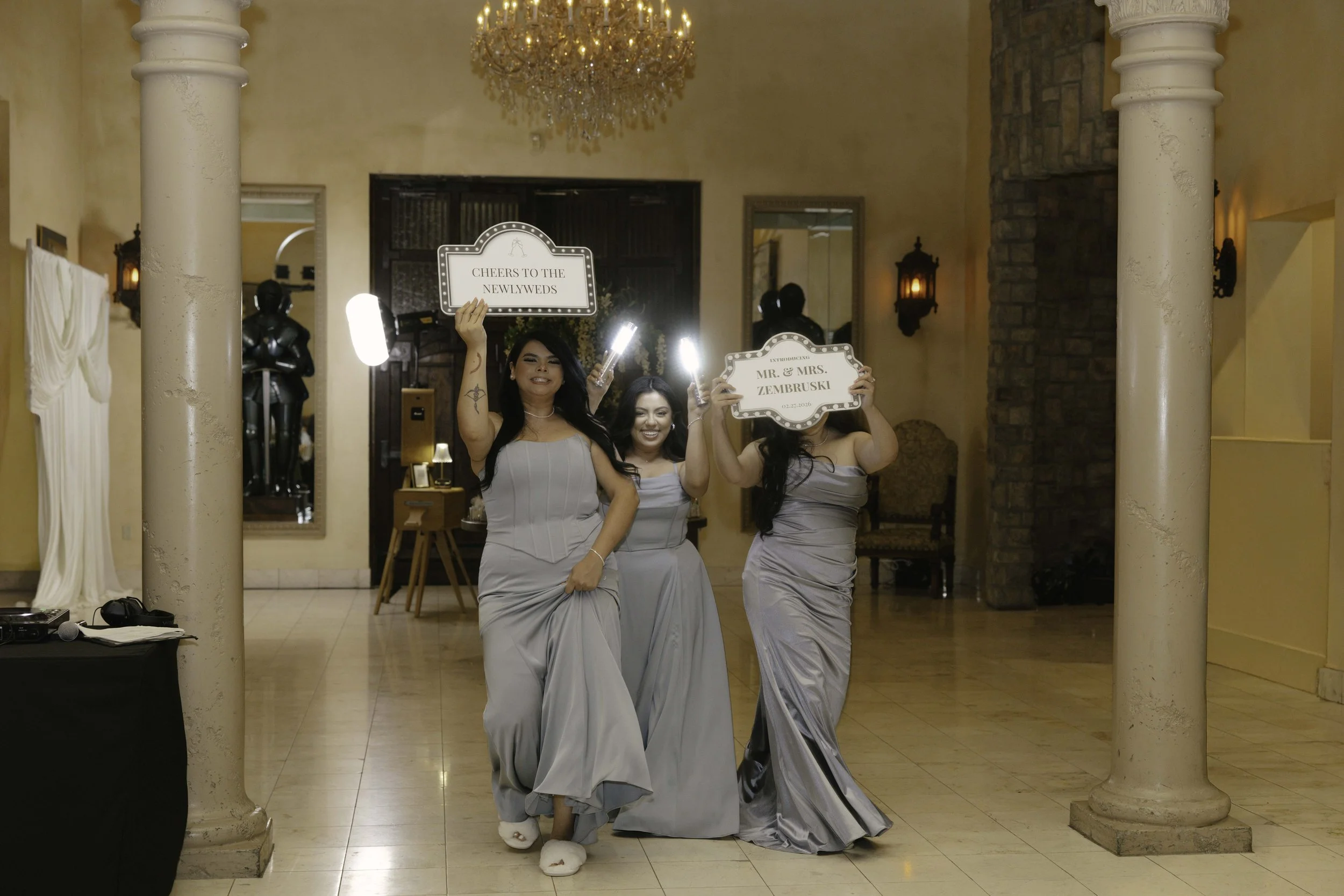 The reception celebration at Ashley Castle in Chandler, Arizona, came to life through hybrid film and digital photography, capturing elegant reception details, joyful bridal party entrances, and lively dance floor moments inside the castle’s grand ba