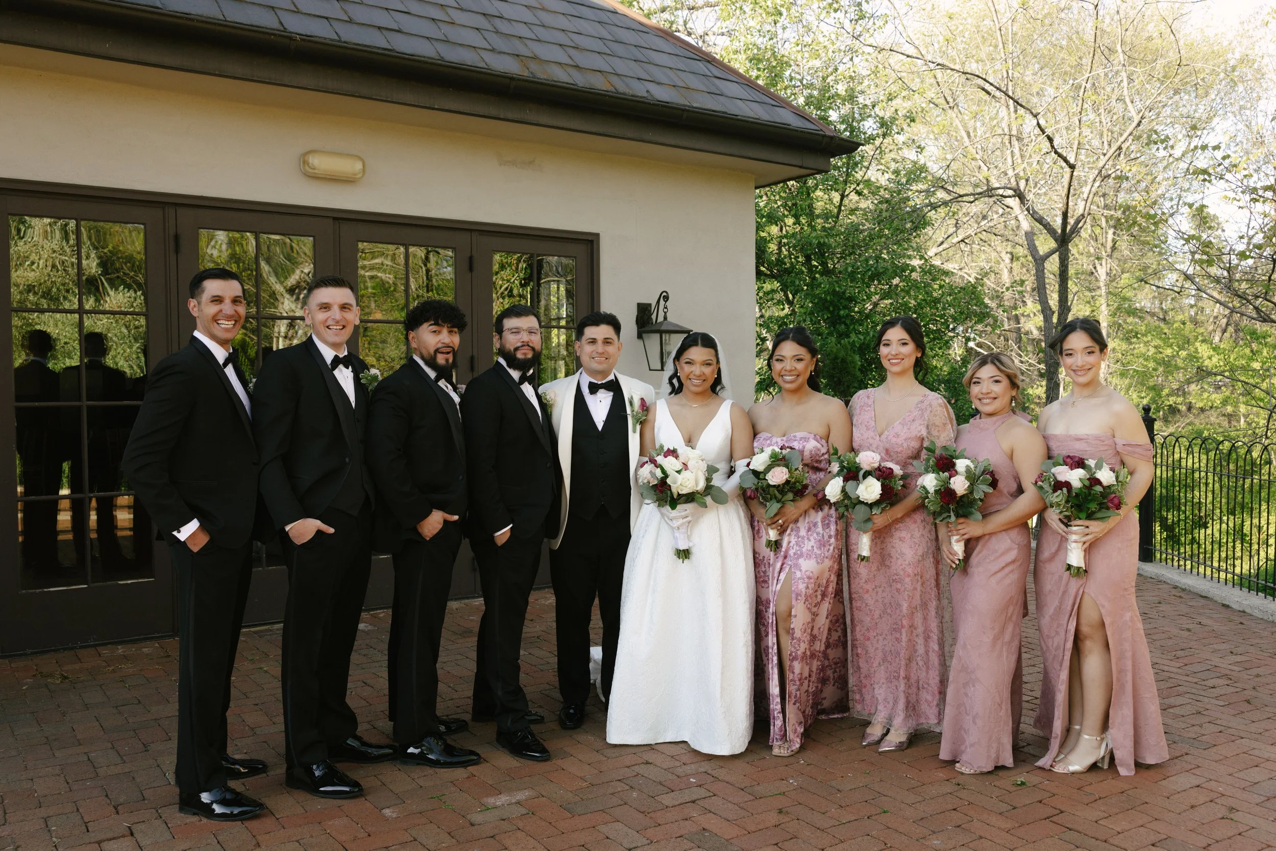 Bridal party portraits at Hotel DuVillage celebrate the bride and groom alongside their closest friends and family. Captured on digital and 35mm film, these images highlight genuine laughter, timeless portraits, and unforgettable moments.