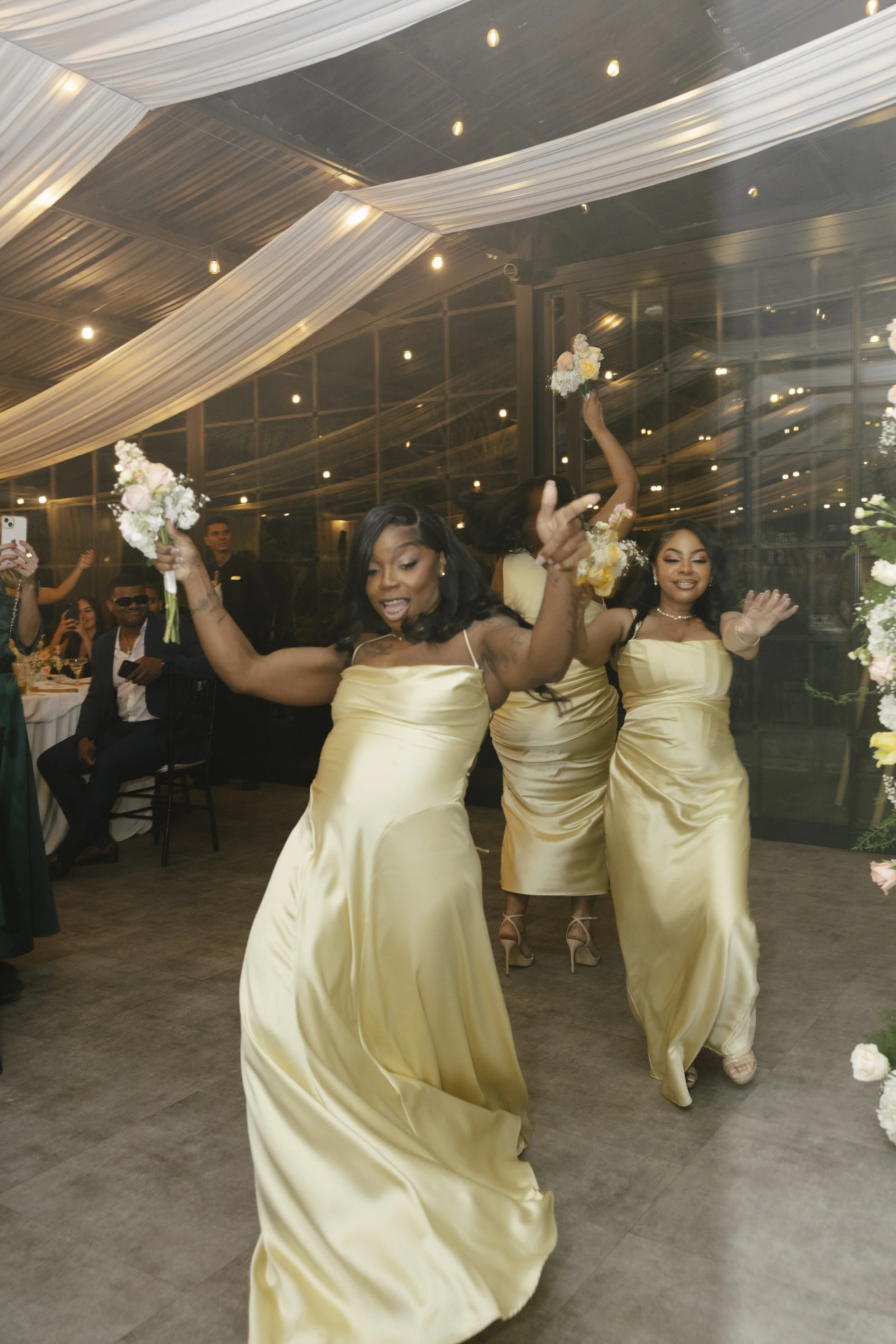 Wedding reception details at Forest Campestre in Medellín, Colombia featuring elegant reception décor, floral tablescapes, wedding cake, custom signage, first dance, and lively celebration captured through documentary wedding photography