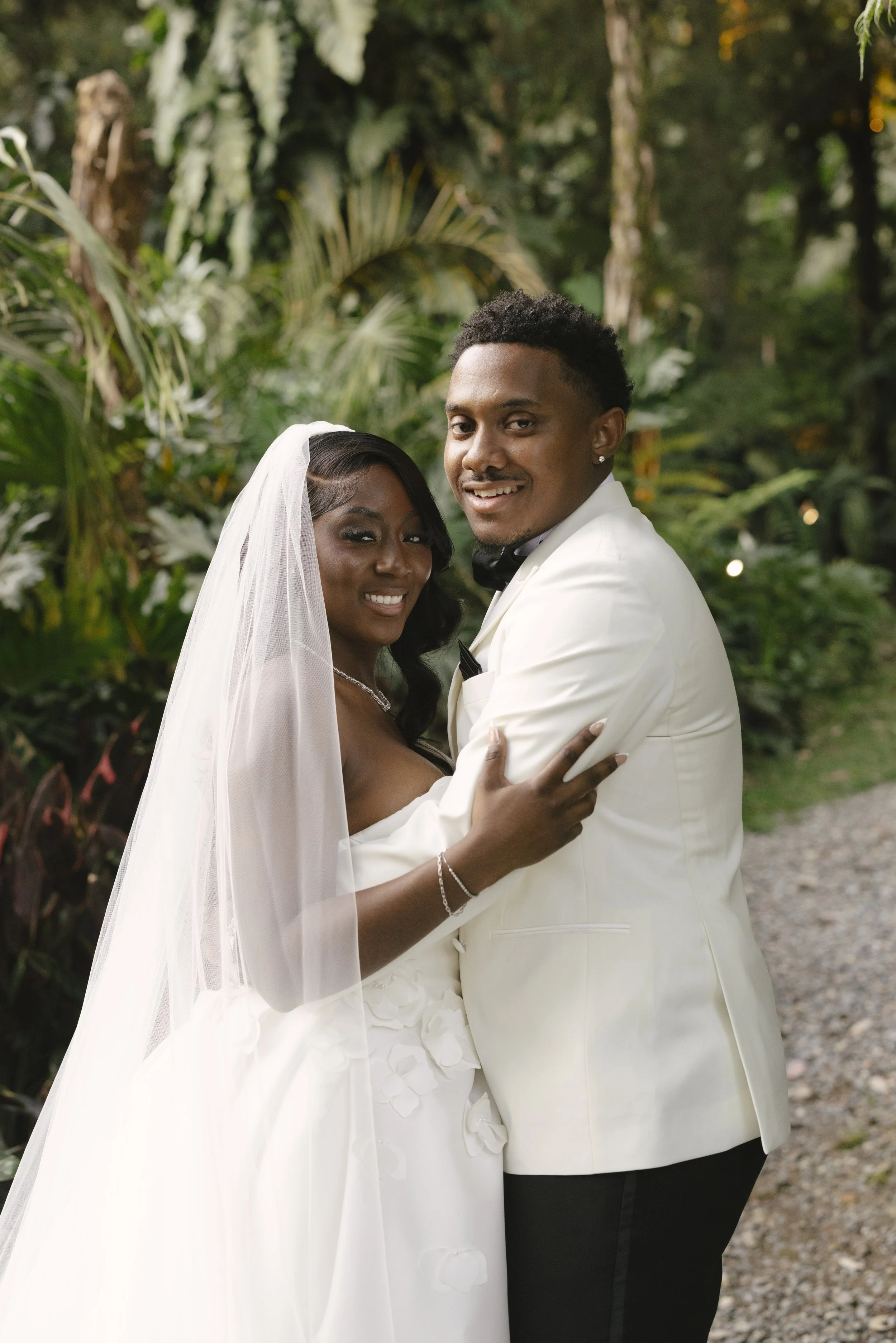 Bride and groom portraits at Forest Campestre in Medellín, Colombia featuring romantic destination wedding photography, lush tropical gardens, bridal party portraits, and natural, documentary-style moments.