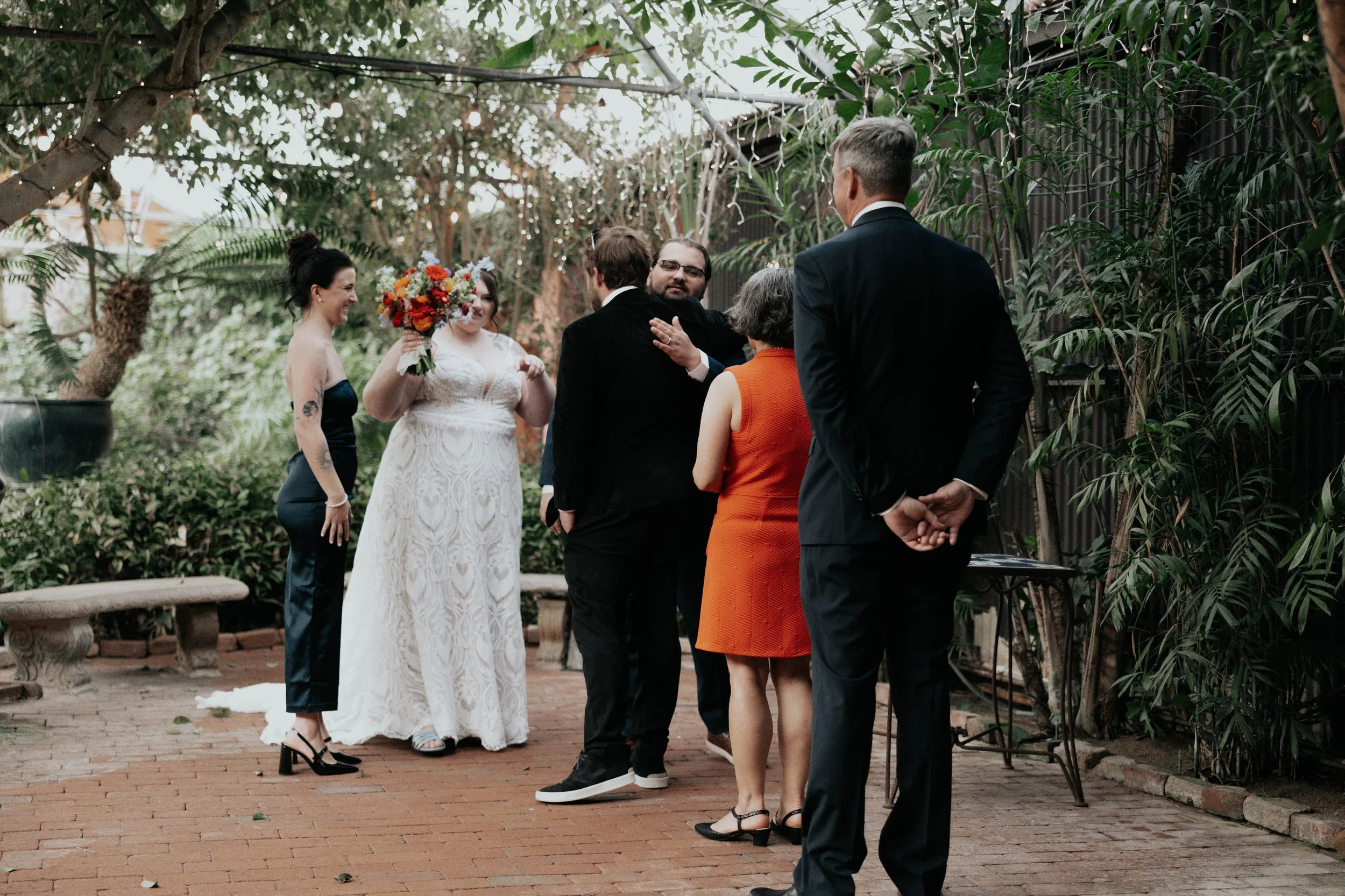 Before the ceremony, Lauren and Joel shared a joyful first look surrounded by the lush greenery of the Boojum Tree in Phoenix. These quiet moments together allowed them to take in the excitement of the day while capturing relaxed portraits before cel