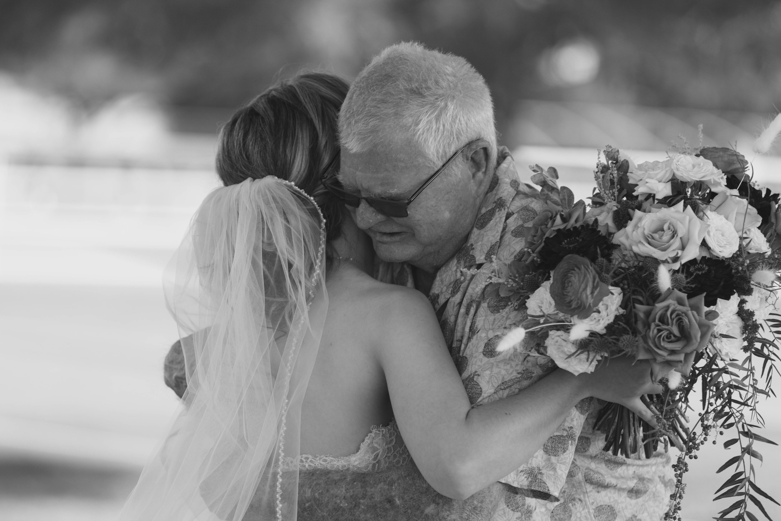 Candid wedding photography from a December wedding at The Knotty Barn in Queen Creek, Arizona, photographed by Raw By Laura, highlighting natural emotion, rustic details, and warm desert tones.