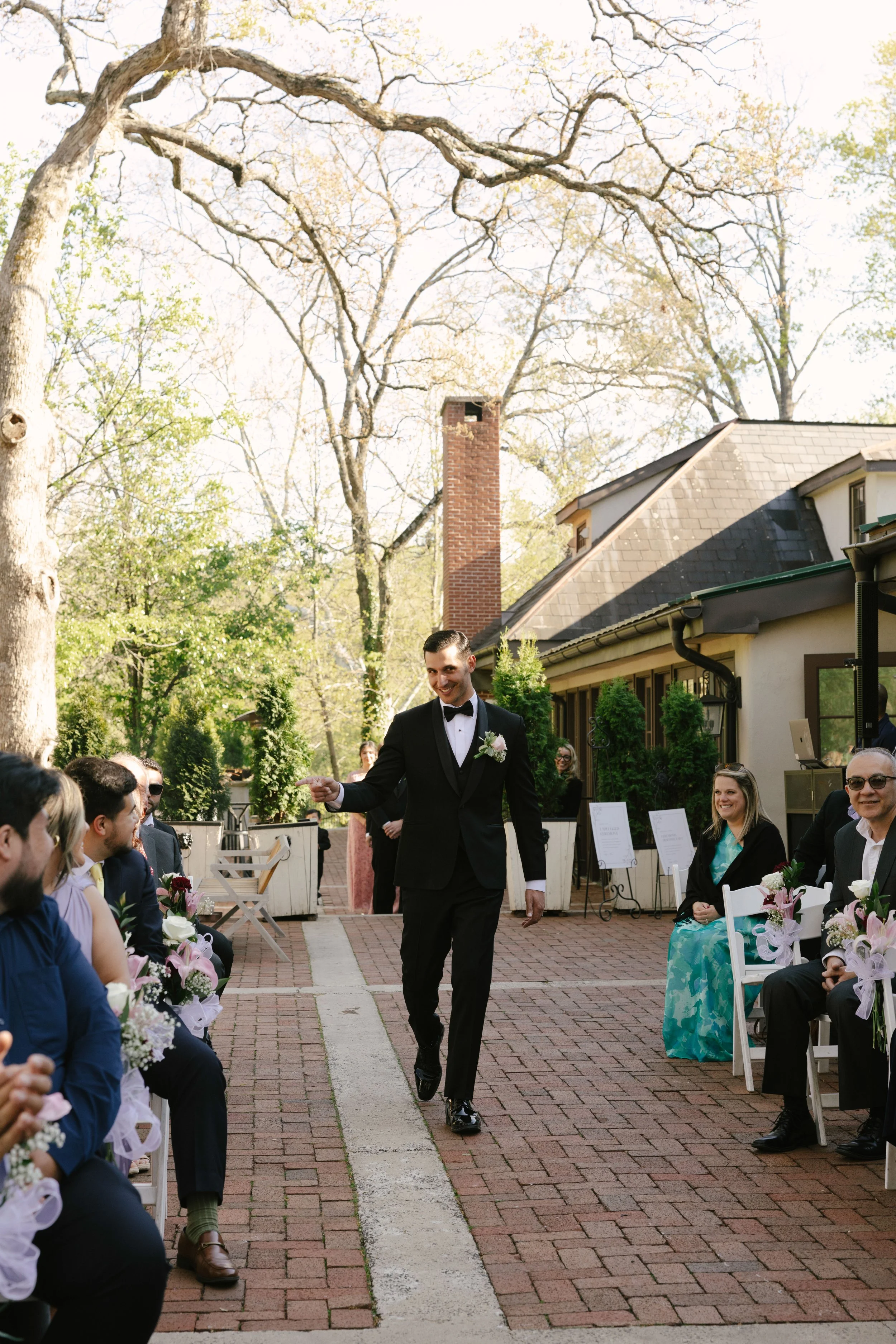 Outdoor wedding ceremony at Hotel DuVillage featuring the bride and groom, wedding party, and meaningful moments captured on both digital and 35mm film. A timeless celebration documented with a candid, documentary approach