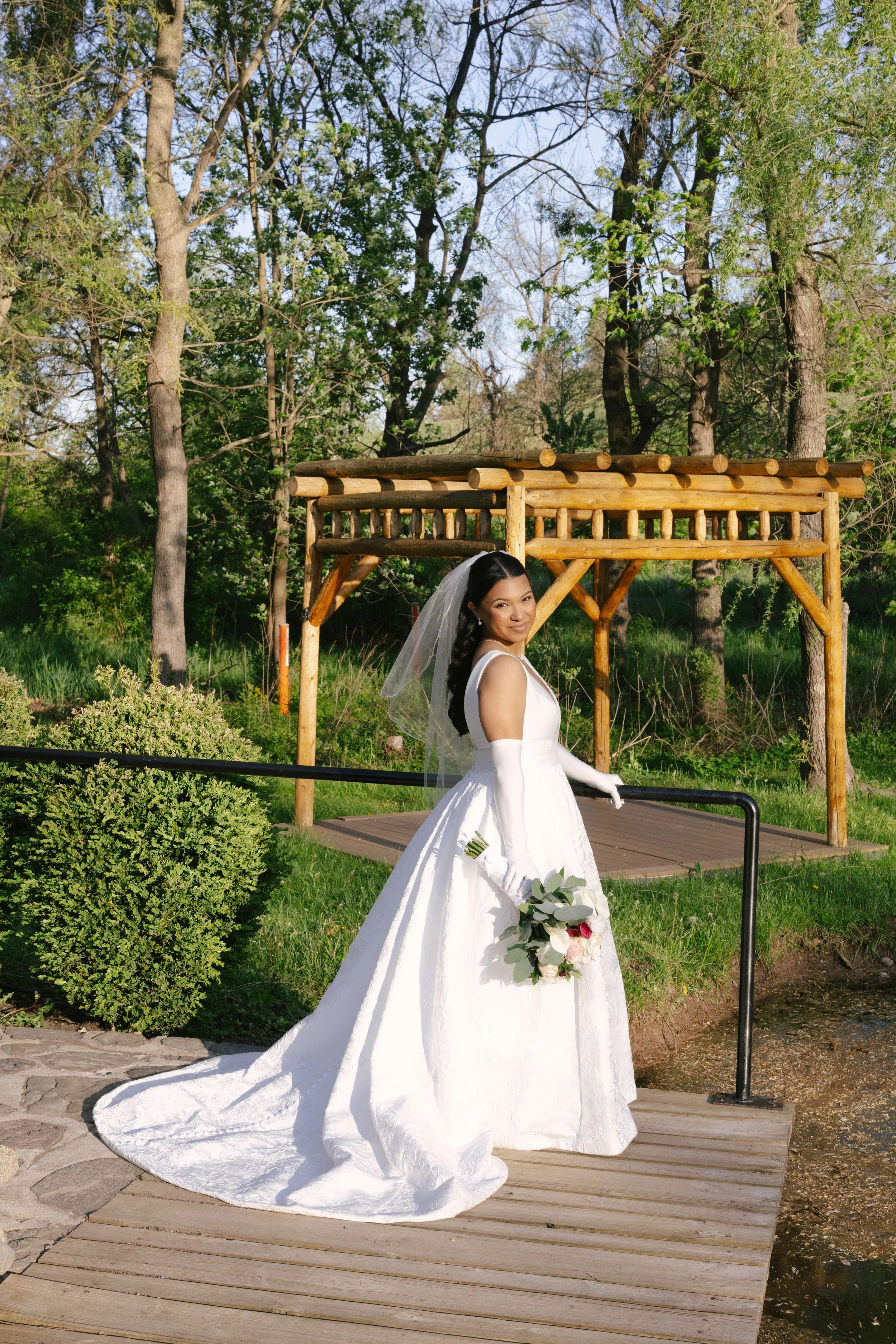 Bride and groom portraits at Hotel DuVillage showcase the venue's picturesque gardens, waterfront views, and timeless charm. Photographed on both digital and 35mm film, these wedding portraits focus on authentic connection, natural movement, and cand