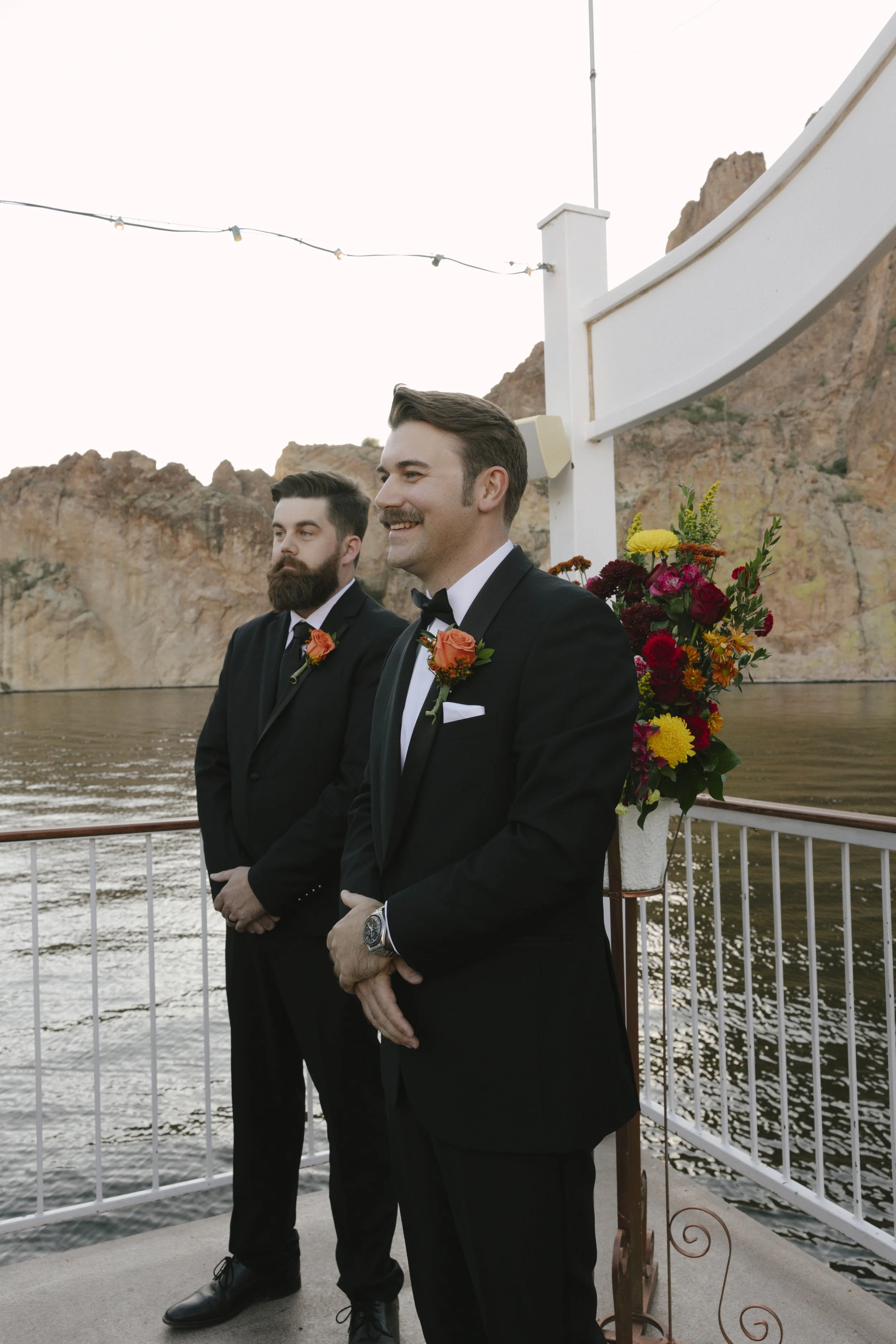 With Canyon Lake’s towering desert cliffs surrounding them, the couple exchanged rings and said “I do” aboard the Dolly Steamboat. Surrounded by about 60 of their closest friends and family, the ceremony took place on the deck with breathtaking Arizo