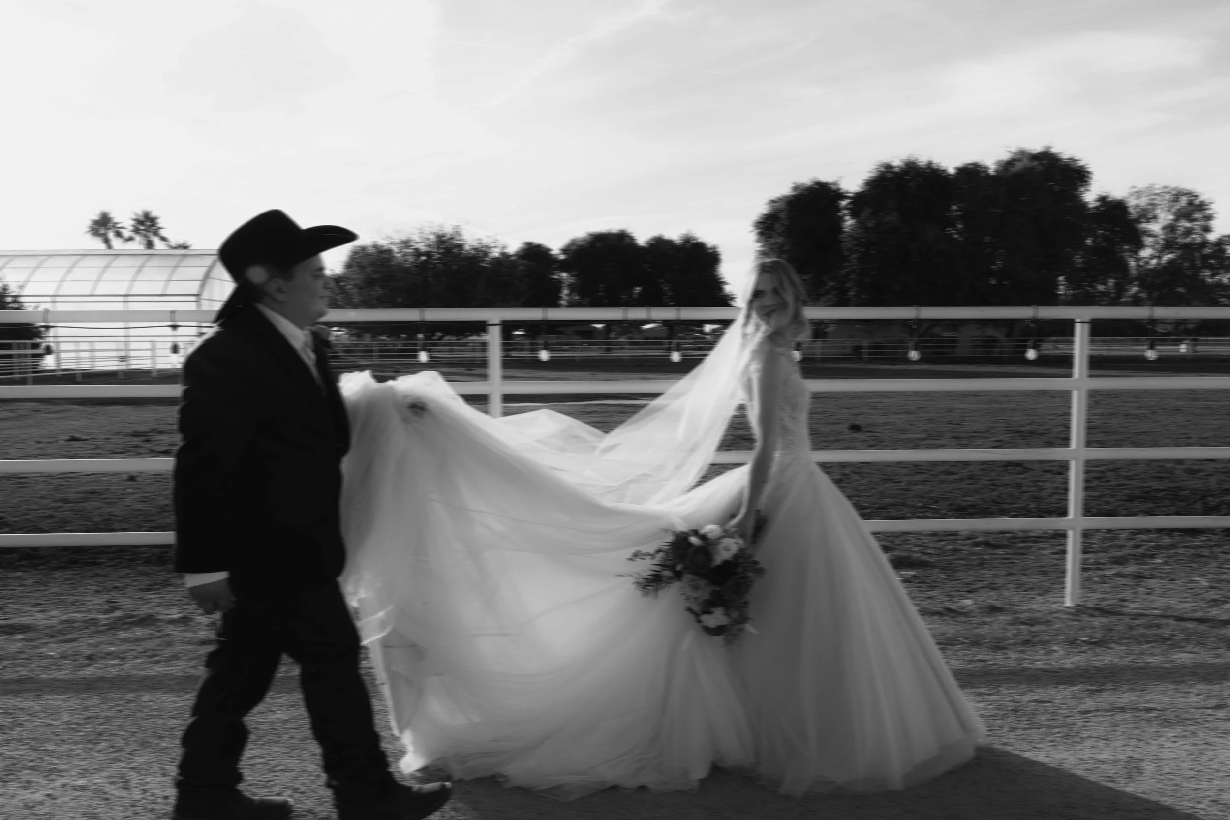 Documentary wedding photography at The Knotty Barn in Queen Creek, Arizona, captured by Arizona wedding photographer Raw By Laura, showcasing authentic moments, desert scenery, and a rustic western wedding setting.