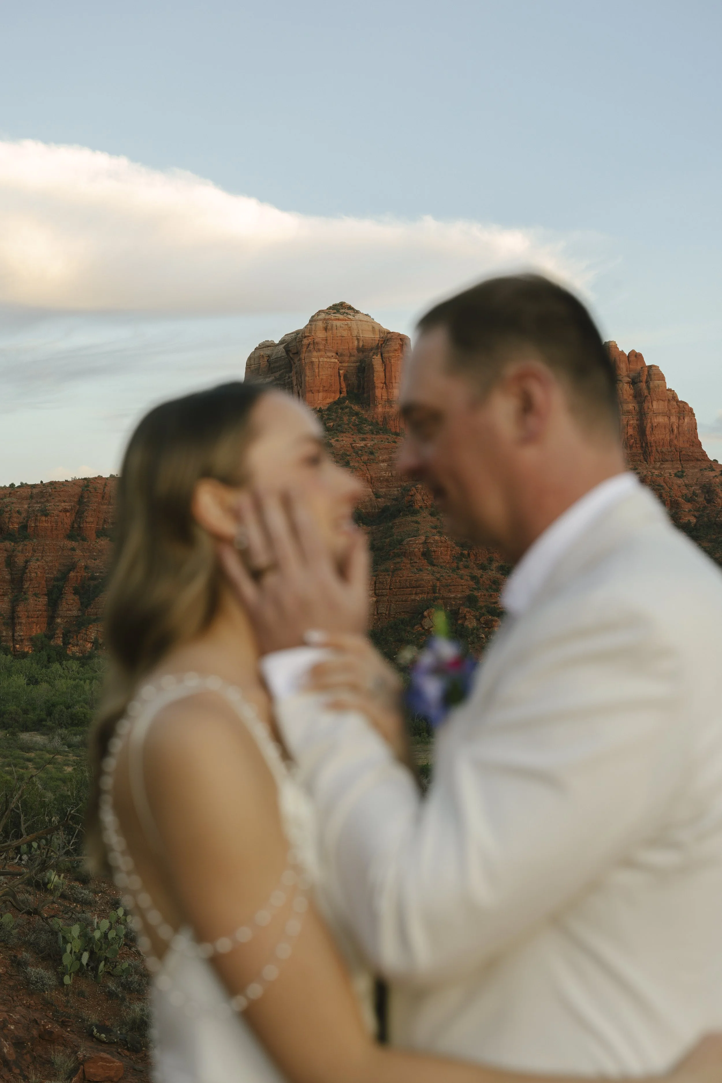 Romantic golden hour portraits at Secret Slick Rock during Chelsea and Travis' intimate Sedona elopement. Featuring Sedona's famous red rock views, stunning Arizona desert landscapes, and timeless wedding photography, these newlywed portraits perfect
