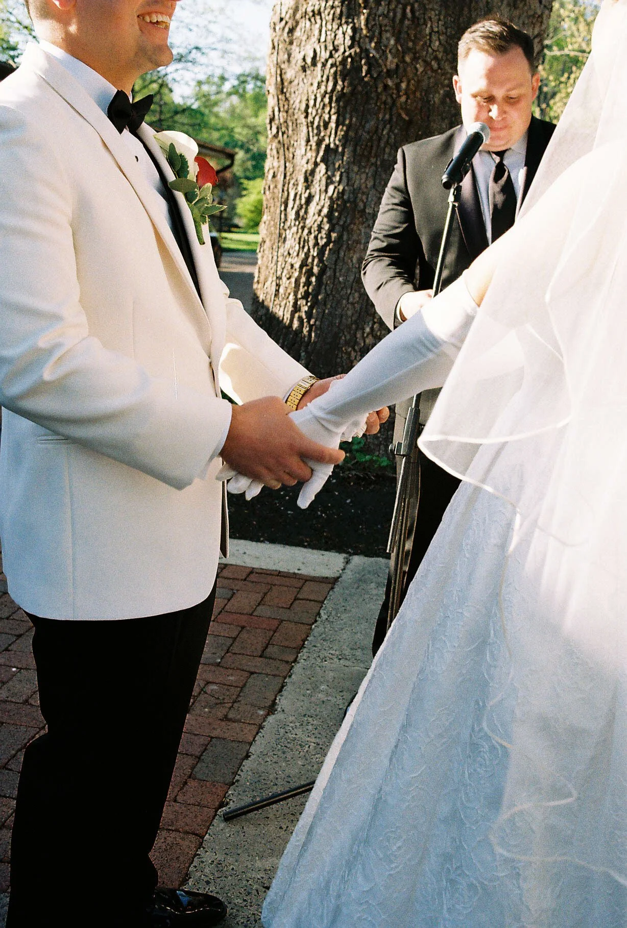 Outdoor wedding ceremony at Hotel DuVillage featuring the bride and groom, wedding party, and meaningful moments captured on both digital and 35mm film. A timeless celebration documented with a candid, documentary approach