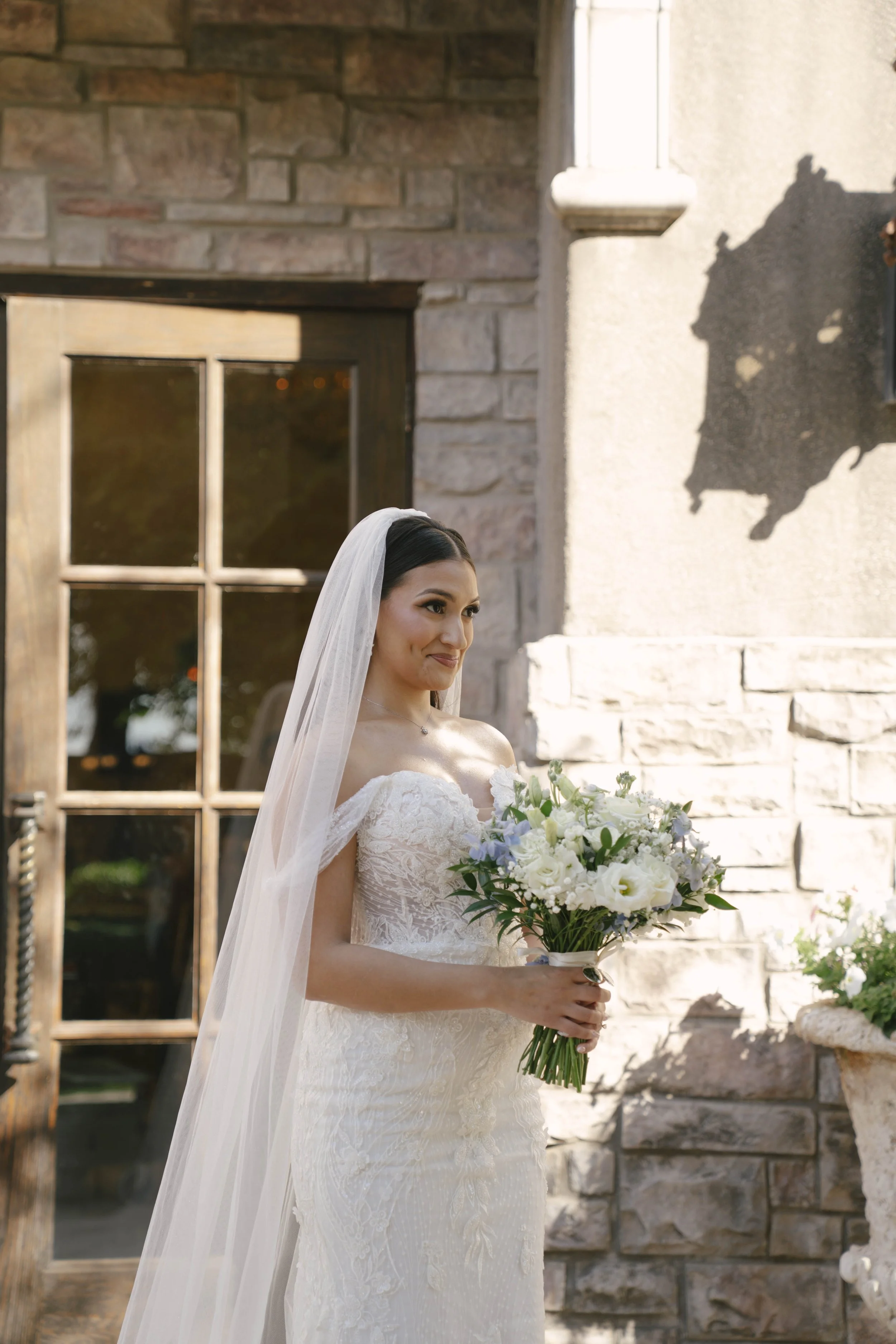 The bride’s first look with her father at Ashley Castle in Chandler, Arizona, was a heartfelt and emotional moment, beautifully documented through hybrid film and digital photography to preserve the joy, love, and anticipation shared before the cerem