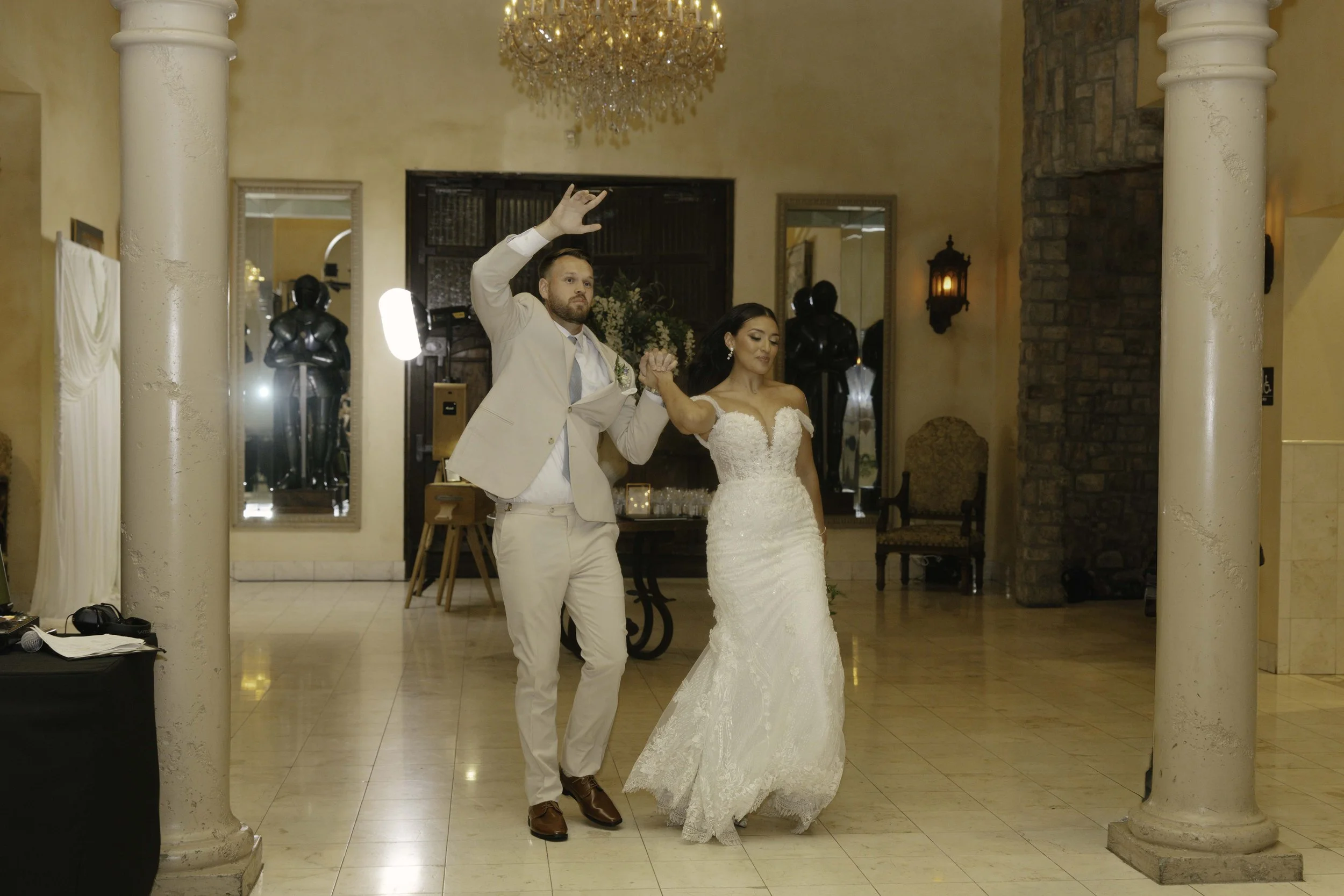 The reception celebration at Ashley Castle in Chandler, Arizona, came to life through hybrid film and digital photography, capturing elegant reception details, joyful bridal party entrances, and lively dance floor moments inside the castle’s grand ba