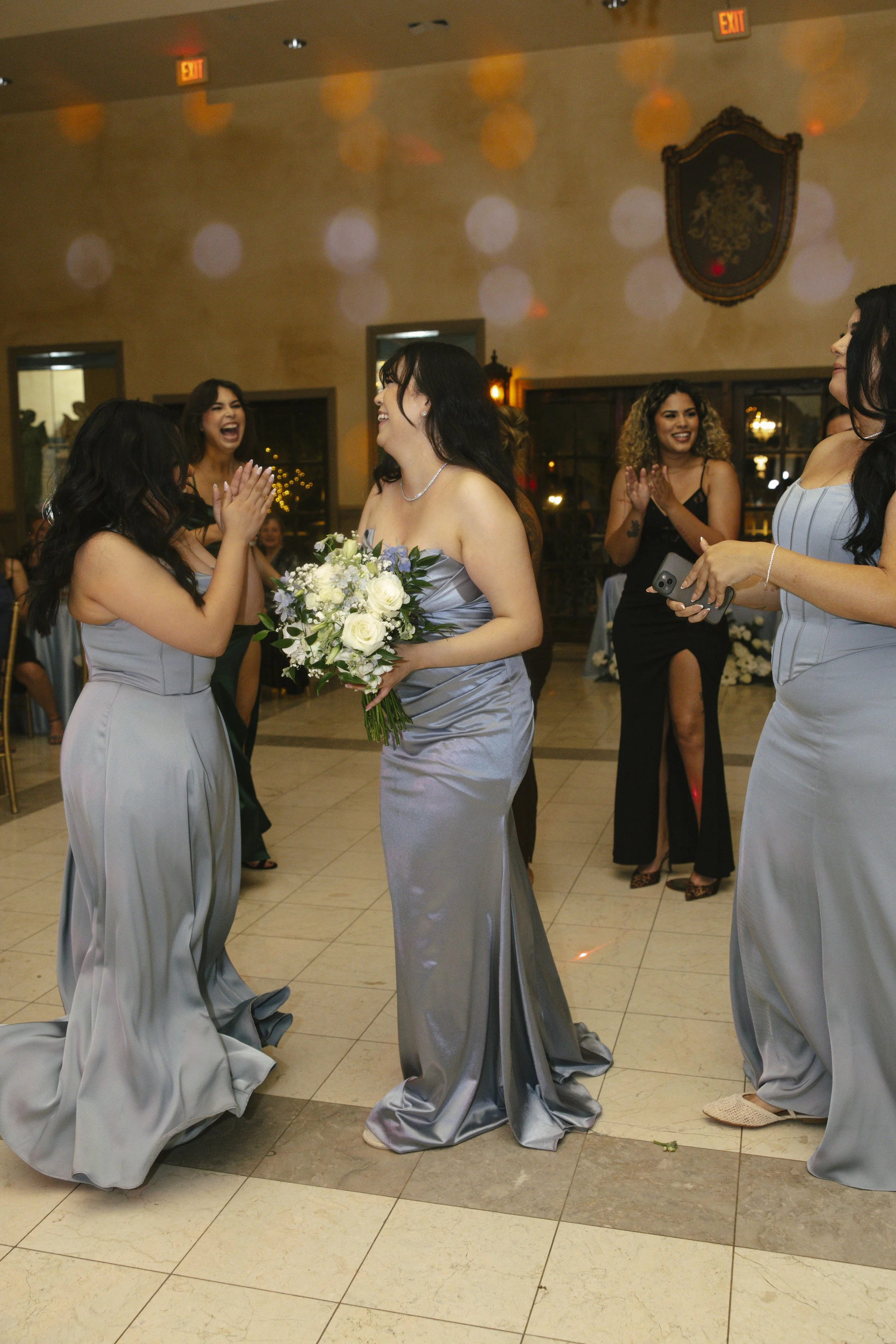 The reception celebration at Ashley Castle in Chandler, Arizona, came to life through hybrid film and digital photography, capturing elegant reception details, joyful bridal party entrances, and lively dance floor moments inside the castle’s grand ba