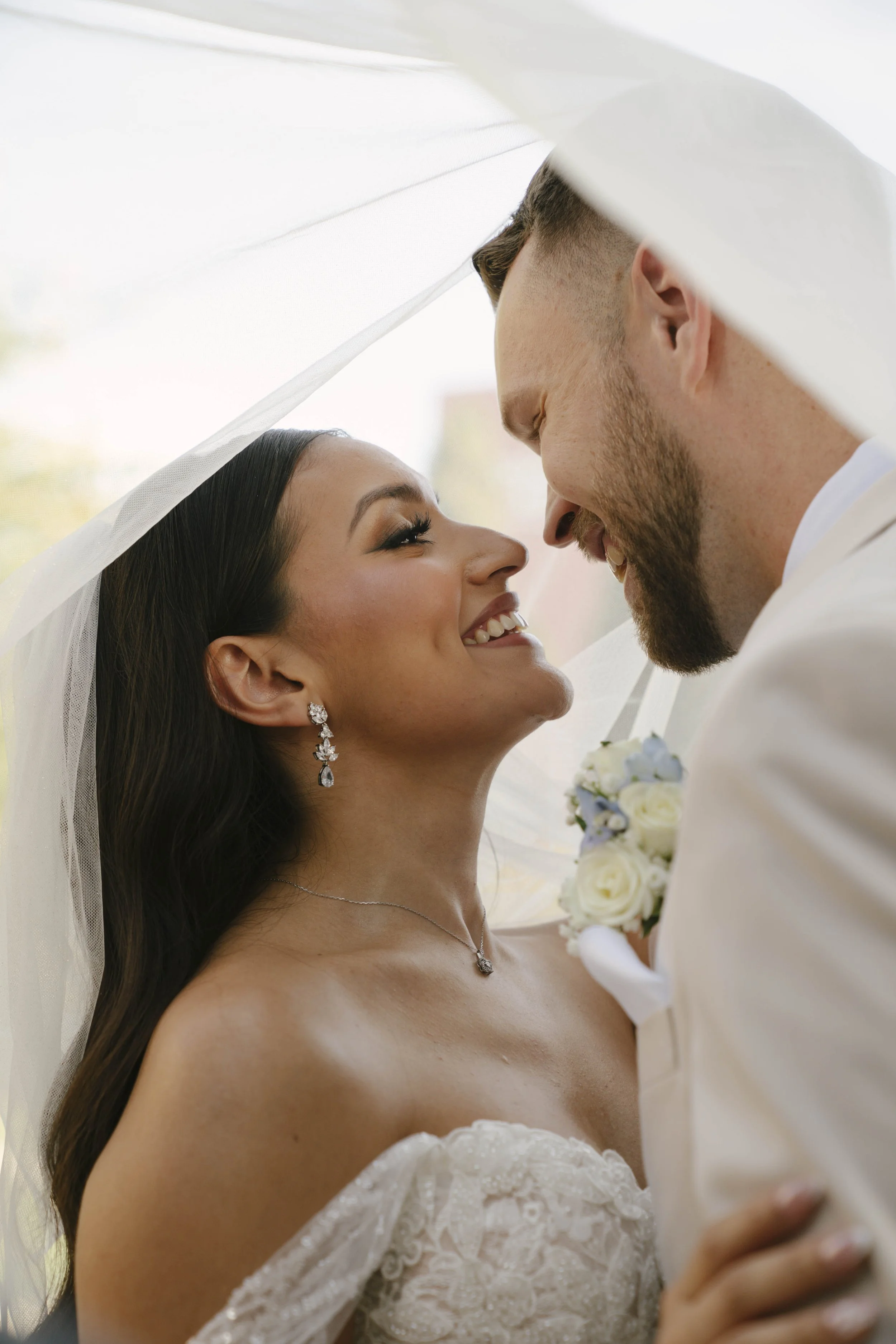 Romantic bride and groom portraits at Ashley Castle in Chandler, Arizona, captured through hybrid film and digital photography, showcase intimate newlywed moments filled with emotion, elegant garden backdrops, and timeless wedding-day connection.