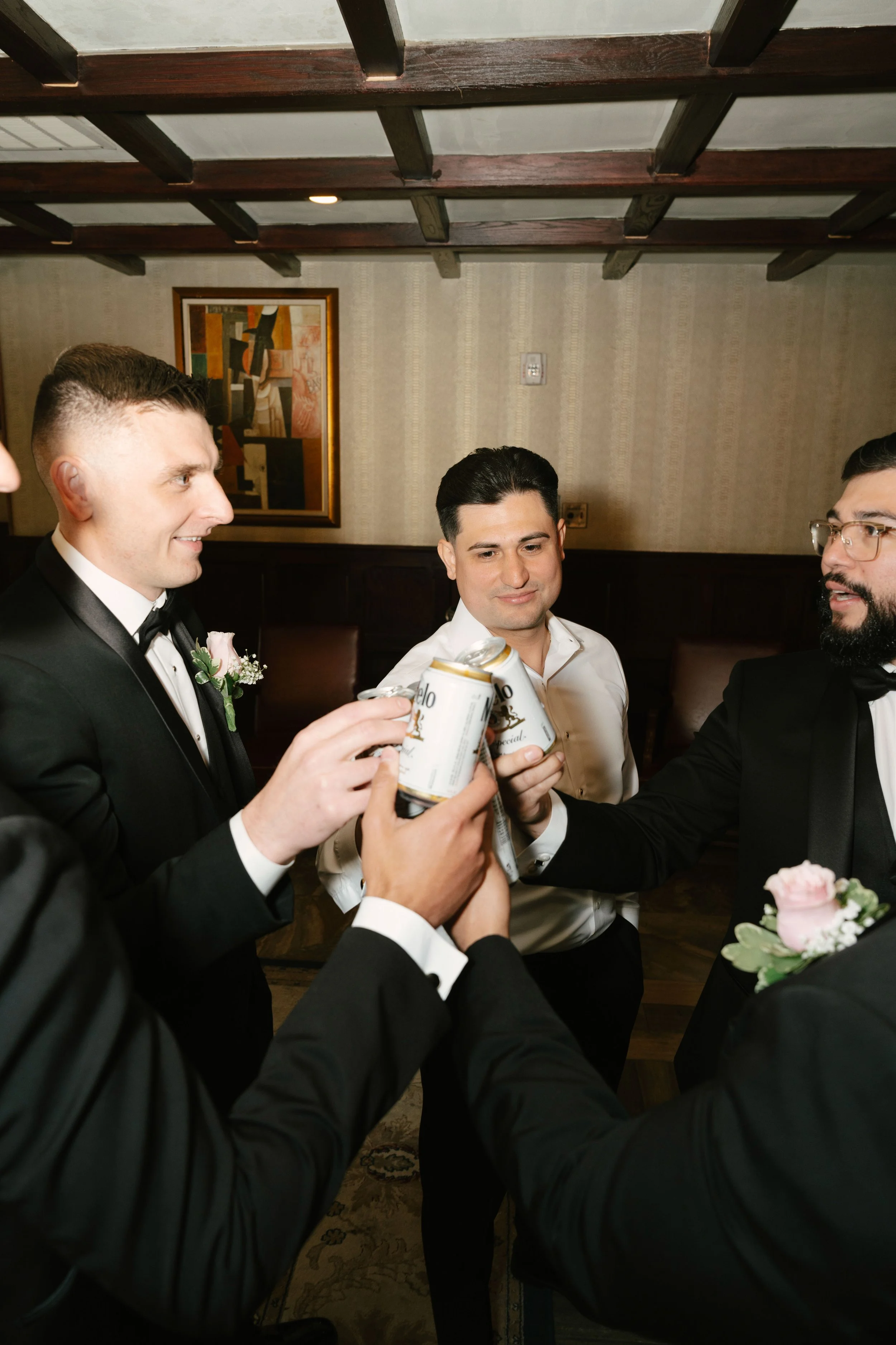 Groom getting ready at Hotel DuVillage before Andy & Elmer's May 2026 wedding. Captured by Raw By Laura using a blend of digital and 35mm film photography, documenting genuine moments with family and friends.