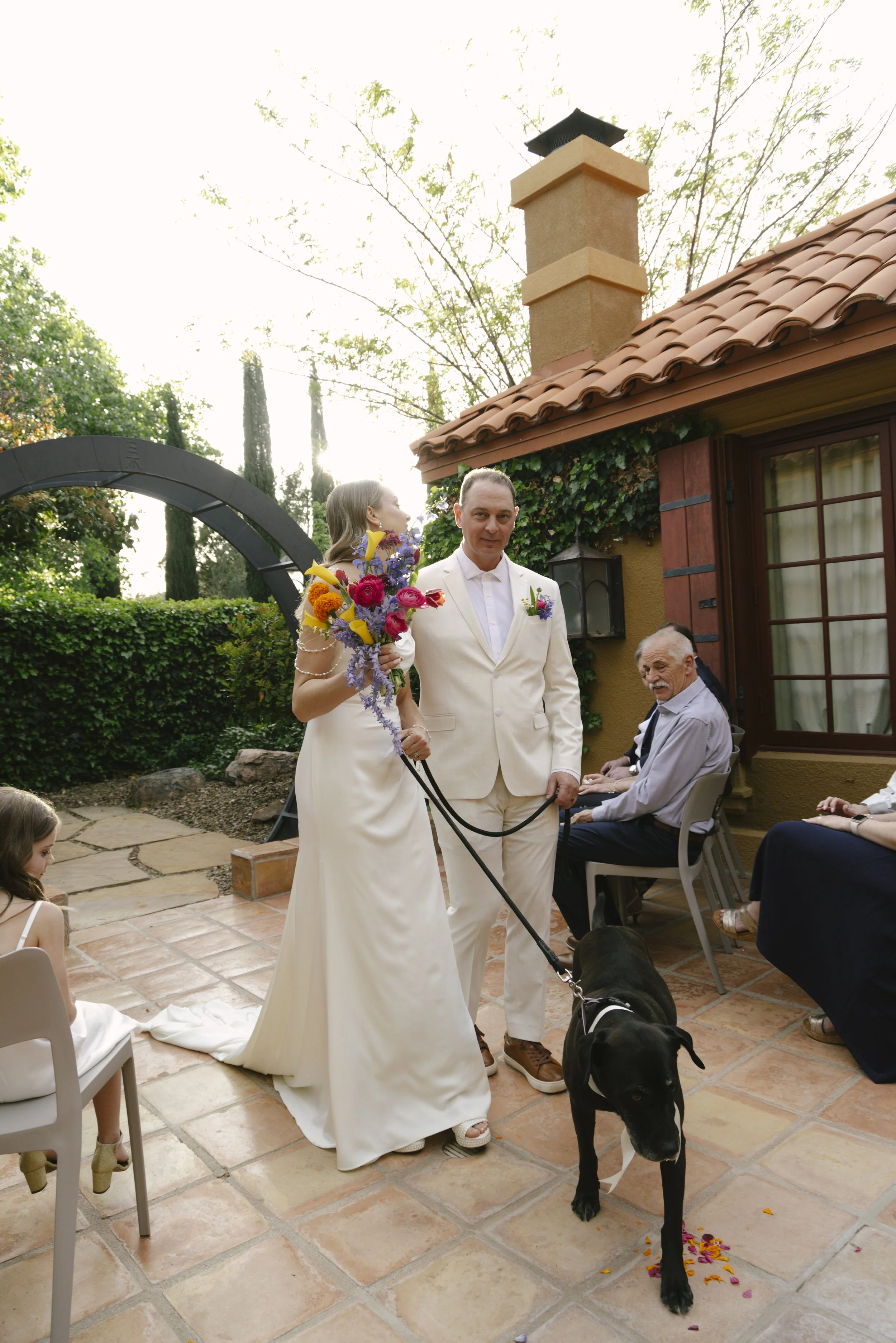 Chelsea and Travis exchanged heartfelt vows during their intimate Sedona elopement at a private Arizona home, surrounded by their closest family, friends, and beloved dog. Their outdoor ceremony was filled with meaningful moments, personal vows, and 
