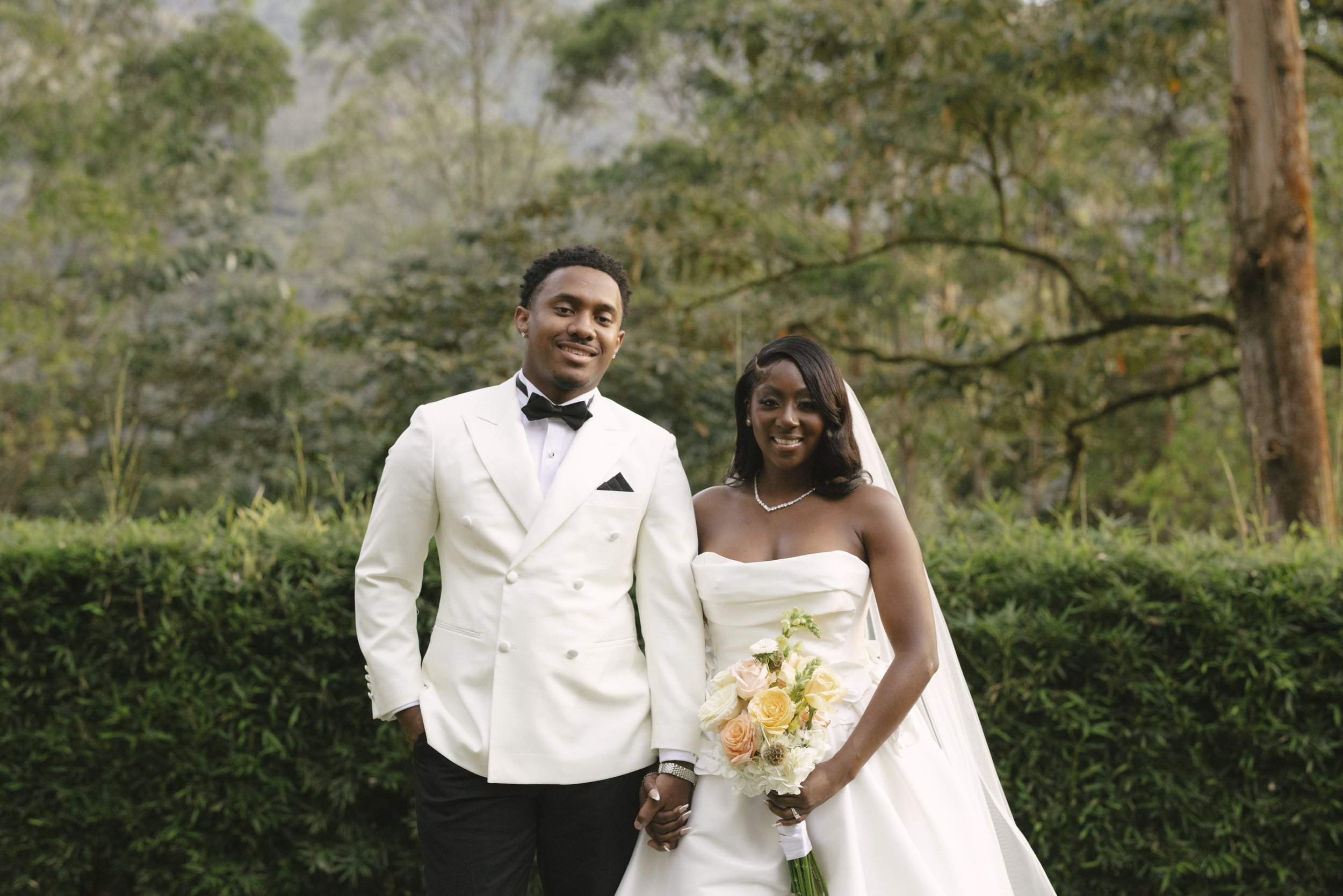 Bride and groom portraits at Forest Campestre in Medellín, Colombia featuring romantic destination wedding photography, lush tropical gardens, bridal party portraits, and natural, documentary-style moments.