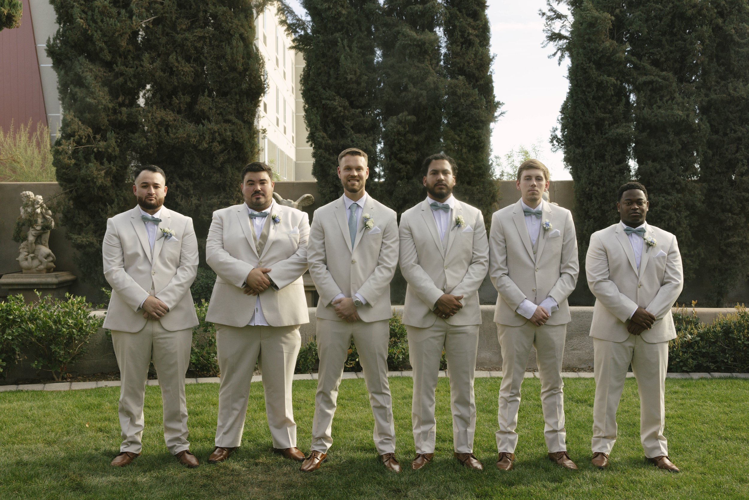 The bridal party portraits at Ashley Castle in Chandler, Arizona, brought playful energy and celebration to the day, with hybrid film and digital photography capturing candid laughter, stylish group moments, and unforgettable memories with the bride,