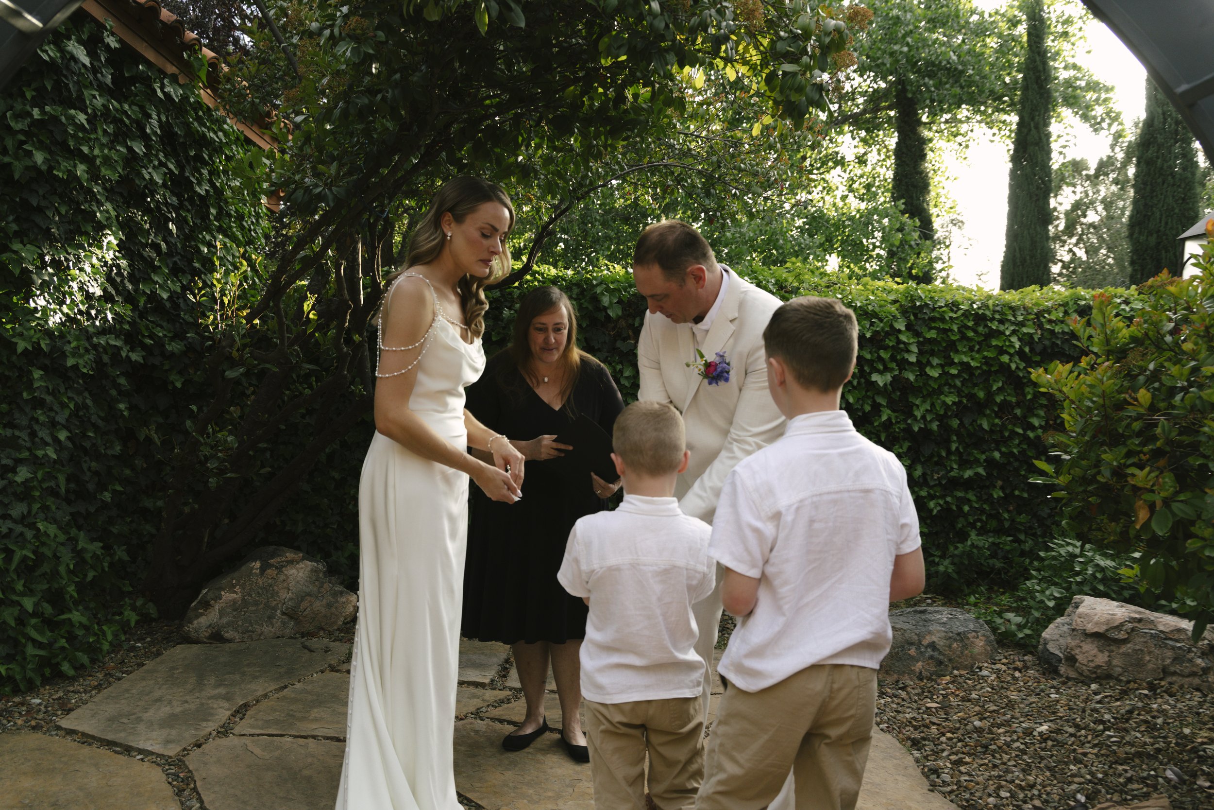 Chelsea and Travis exchanged heartfelt vows during their intimate Sedona elopement at a private Arizona home, surrounded by their closest family, friends, and beloved dog. Their outdoor ceremony was filled with meaningful moments, personal vows, and 