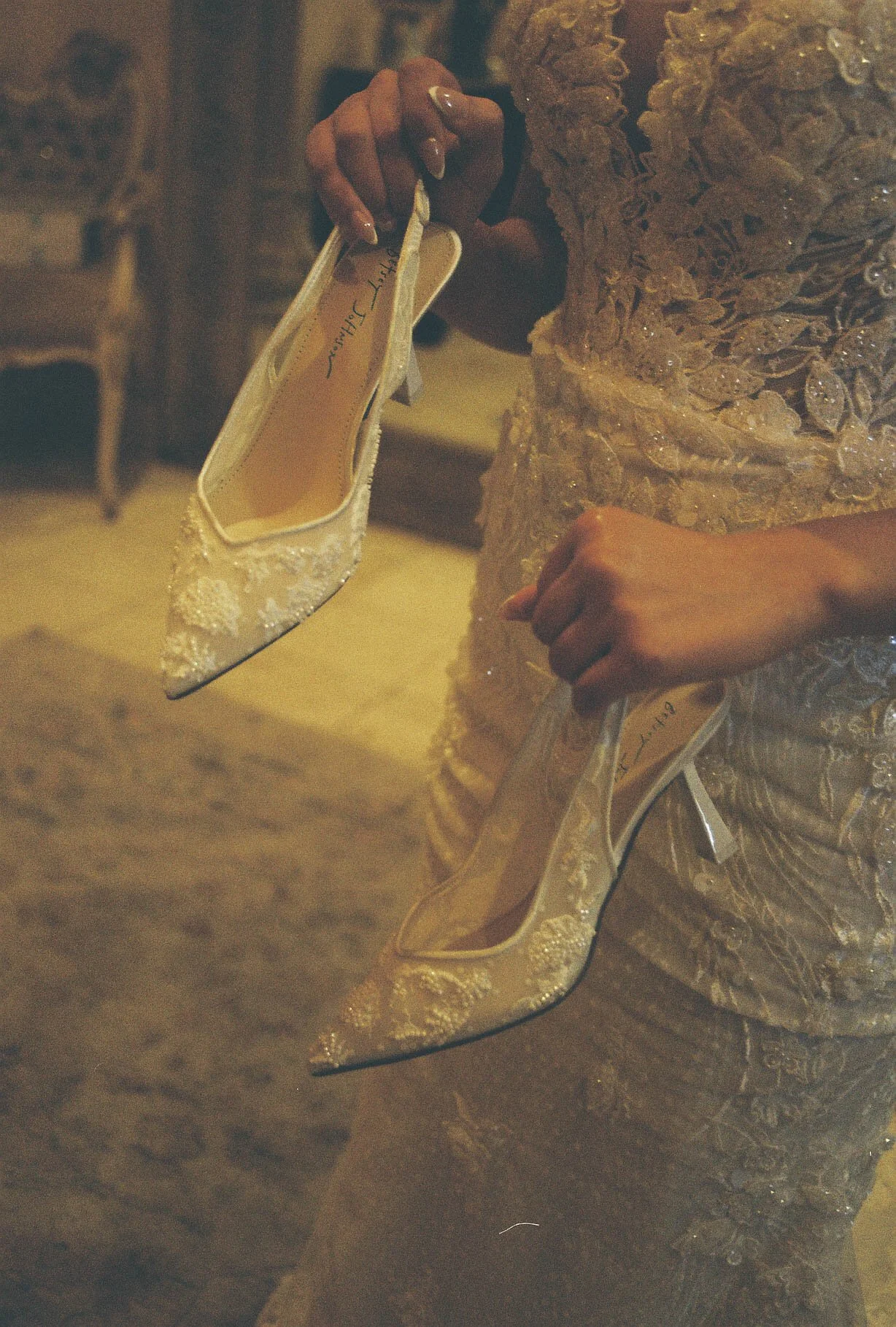 The bride’s final getting-ready moments at Ashley Castle in Chandler, Arizona, were captured through hybrid film and digital photography, preserving the intimate details of dress fastening, veil placement, and bridal finishing touches with timeless e