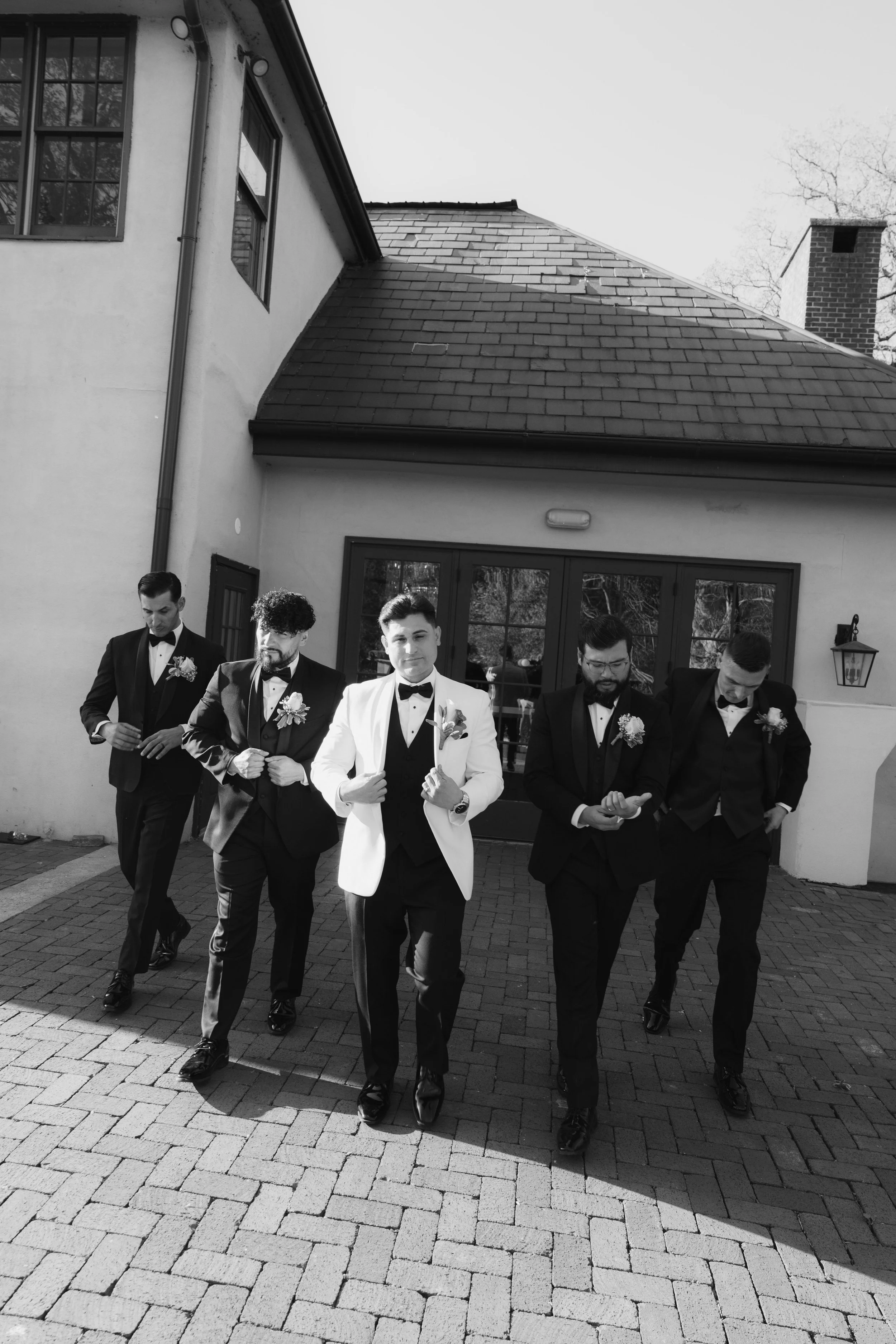 Bridal party portraits at Hotel DuVillage celebrate the bride and groom alongside their closest friends and family. Captured on digital and 35mm film, these images highlight genuine laughter, timeless portraits, and unforgettable moments.