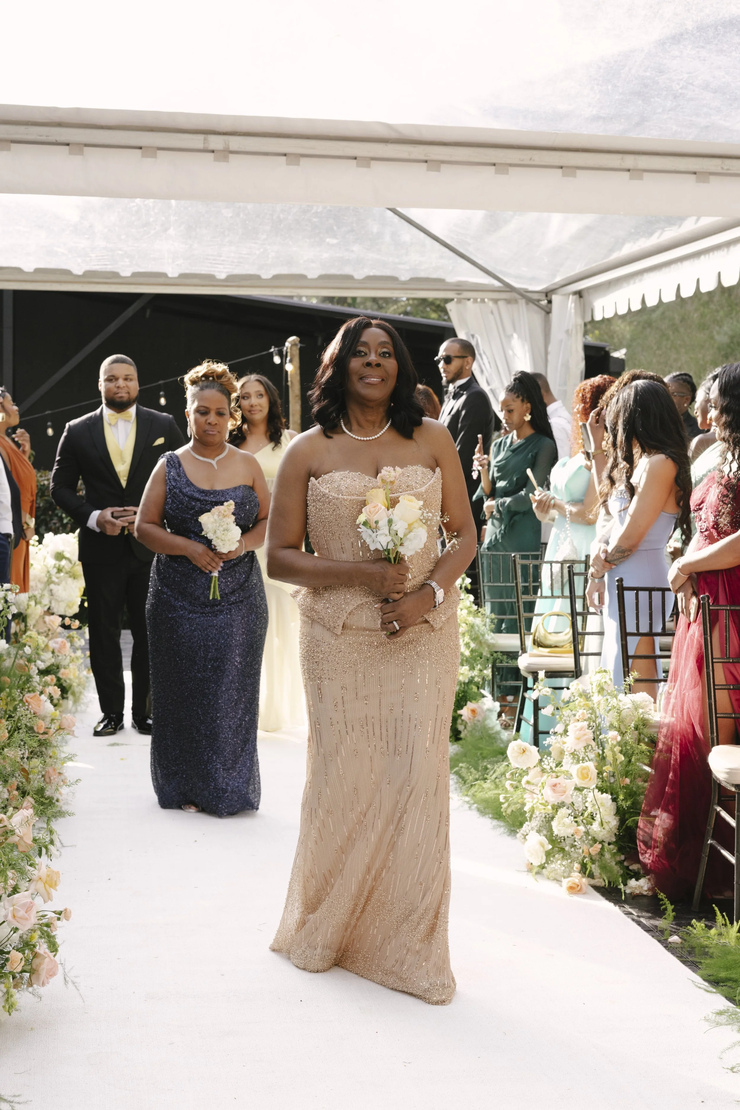Forest Campestre wedding ceremony in Medellín, Colombia featuring the bridal processional, groom's reaction, emotional ceremony moments, floral aisle design, wedding guests, and documentary-style wedding photography
