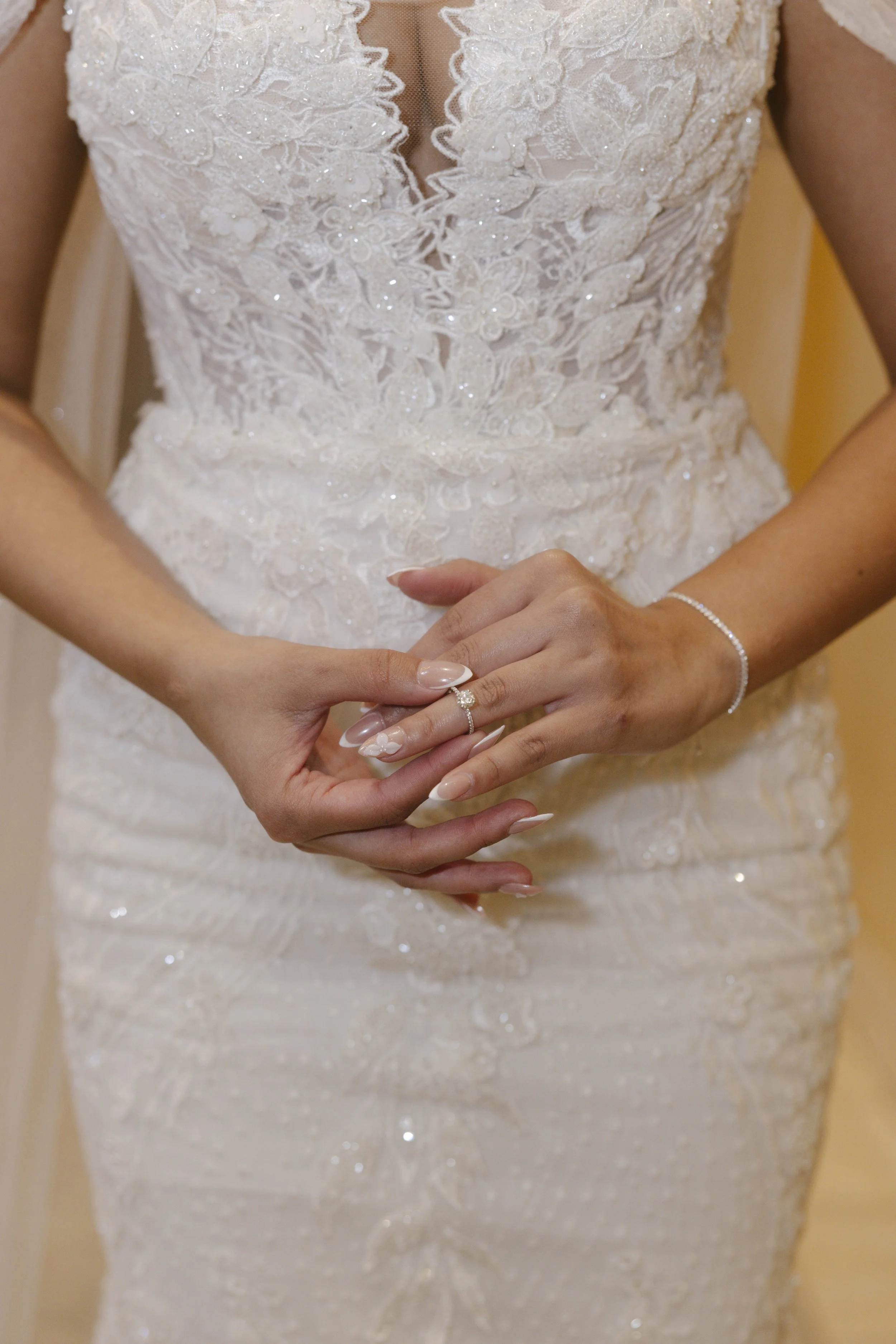 The bride’s final getting-ready moments at Ashley Castle in Chandler, Arizona, were captured through hybrid film and digital photography, preserving the intimate details of dress fastening, veil placement, and bridal finishing touches with timeless e