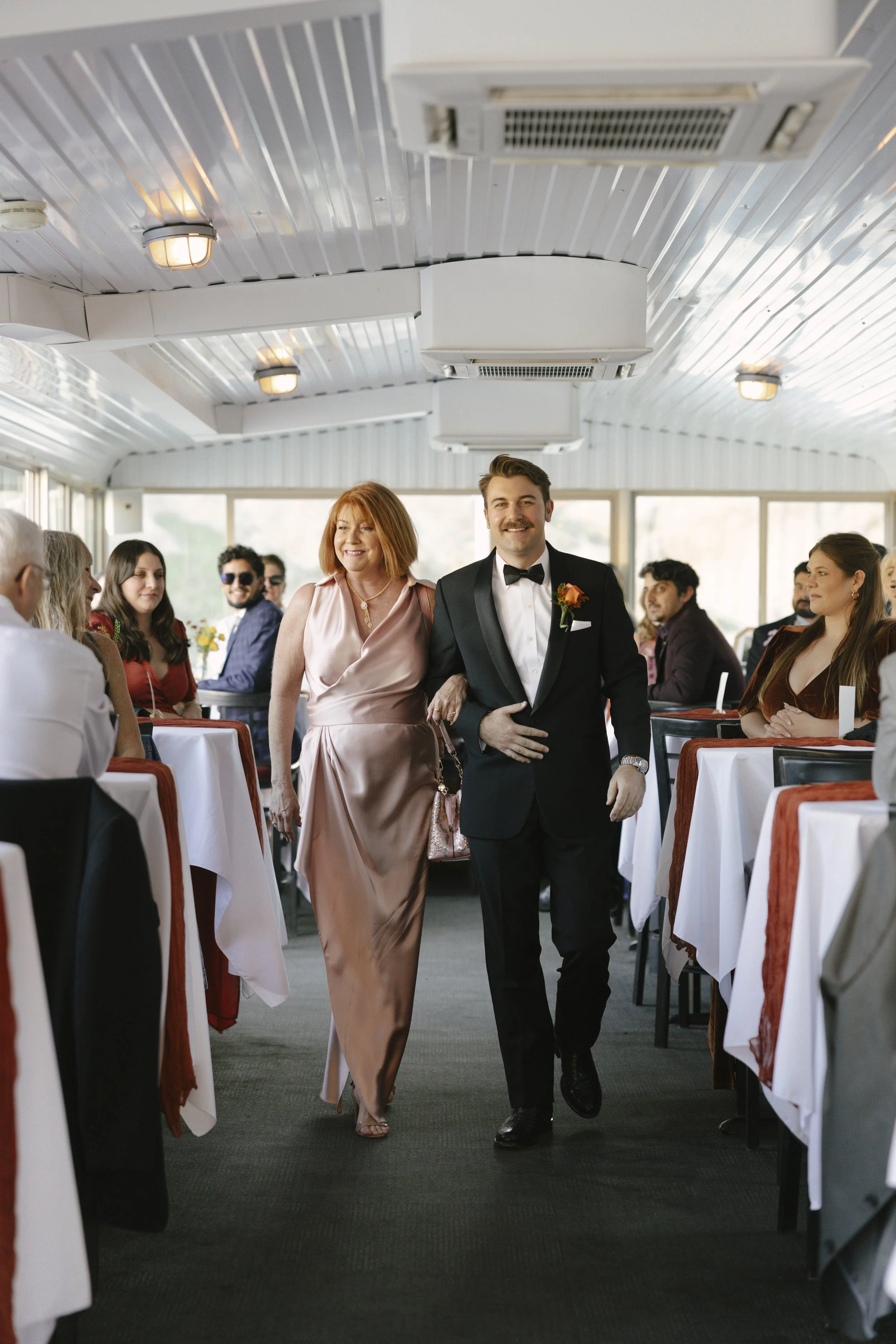 With Canyon Lake’s towering desert cliffs surrounding them, the couple exchanged rings and said “I do” aboard the Dolly Steamboat. Surrounded by about 60 of their closest friends and family, the ceremony took place on the deck with breathtaking Arizo