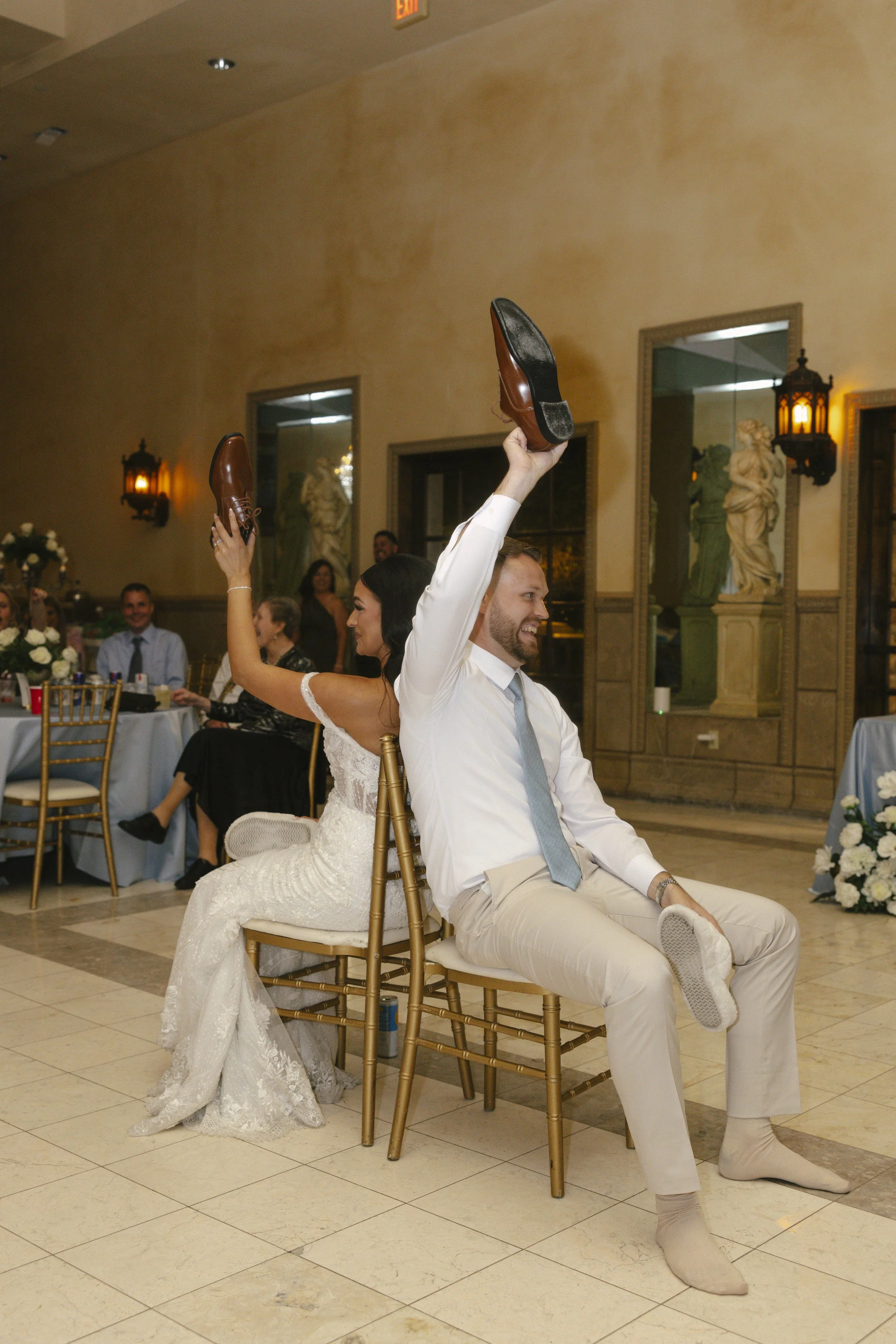 The reception celebration at Ashley Castle in Chandler, Arizona, came to life through hybrid film and digital photography, capturing elegant reception details, joyful bridal party entrances, and lively dance floor moments inside the castle’s grand ba