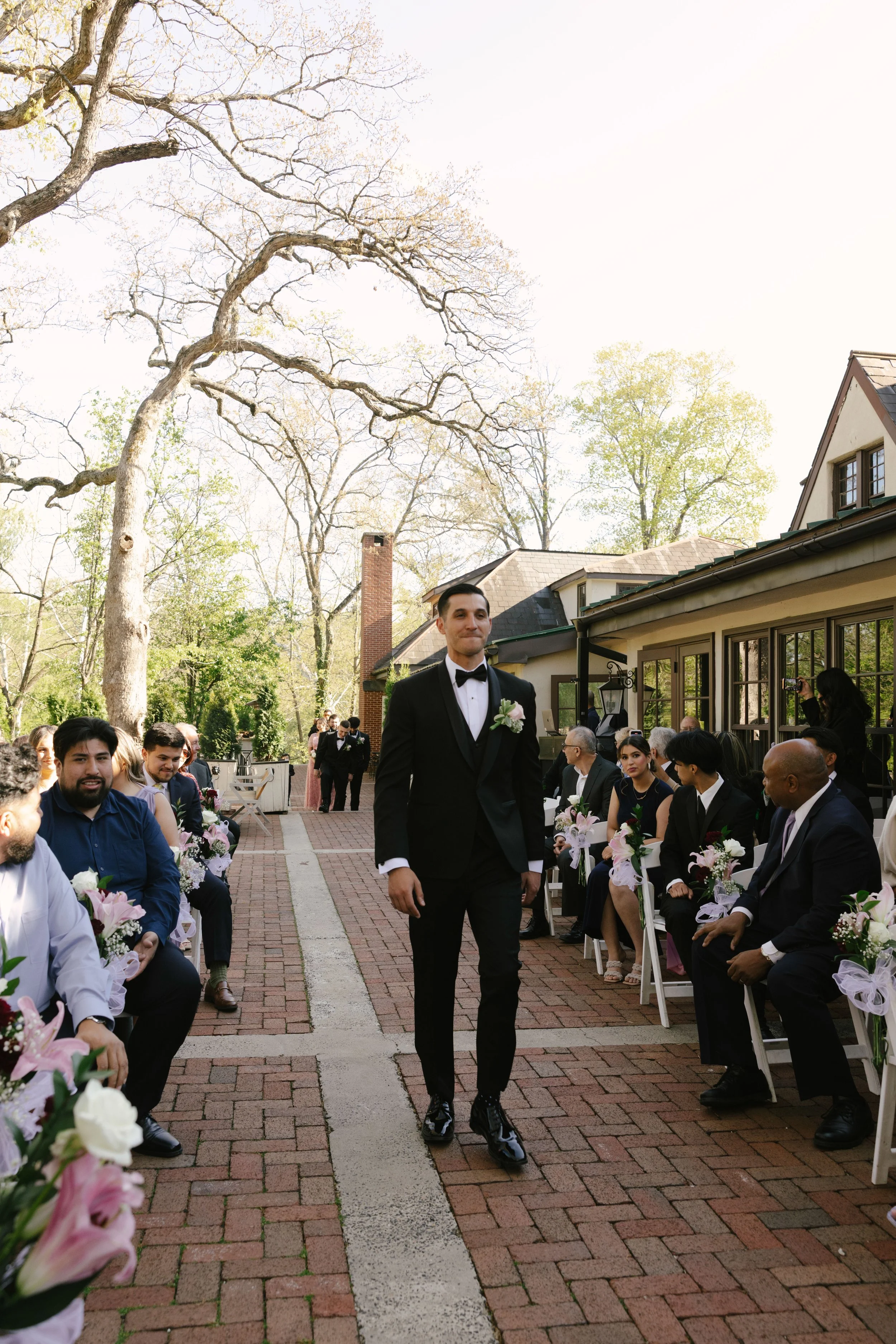 Outdoor wedding ceremony at Hotel DuVillage featuring the bride and groom, wedding party, and meaningful moments captured on both digital and 35mm film. A timeless celebration documented with a candid, documentary approach