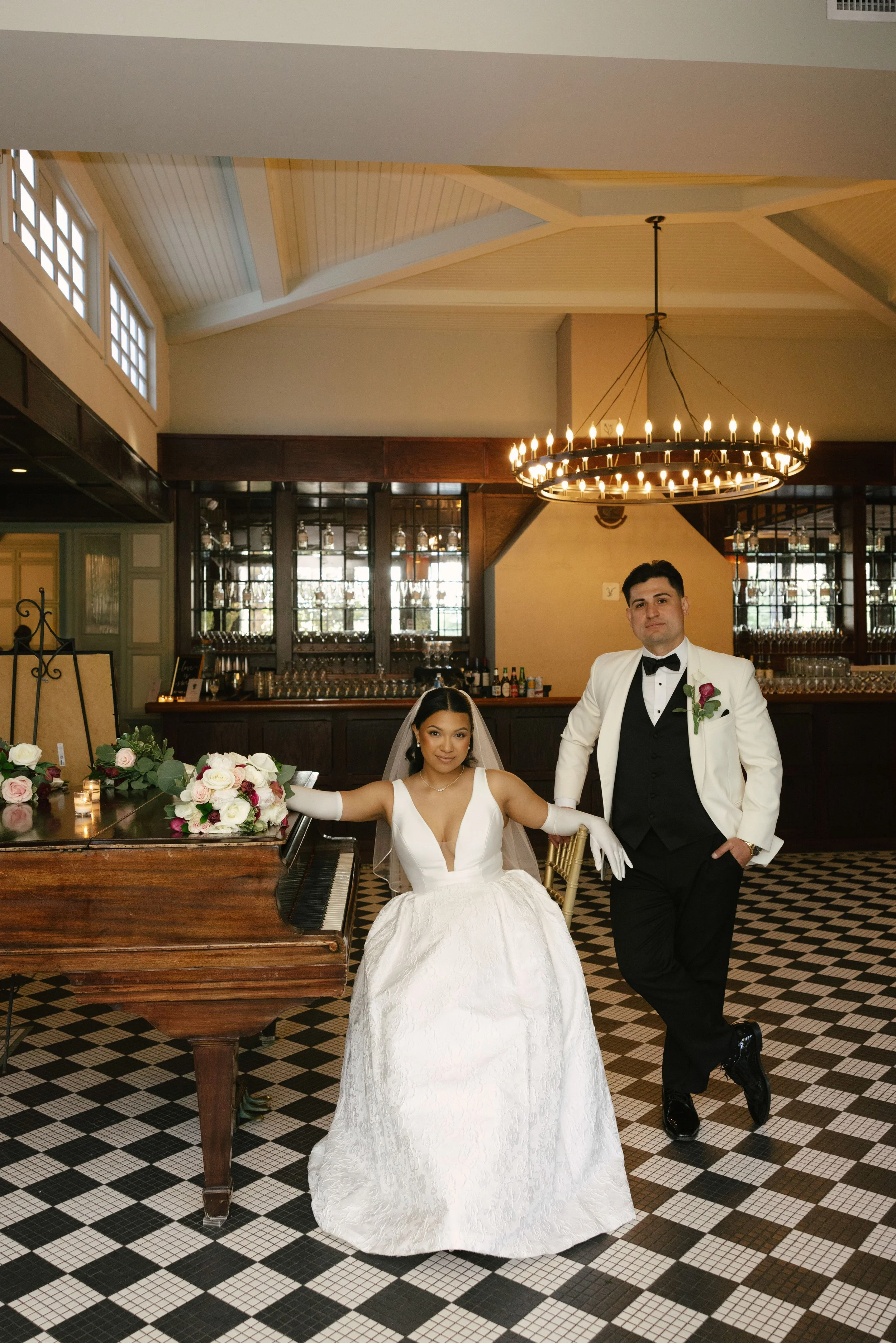 Bride and groom portraits at Hotel DuVillage showcase the venue's picturesque gardens, waterfront views, and timeless charm. Photographed on both digital and 35mm film, these wedding portraits focus on authentic connection, natural movement, and cand
