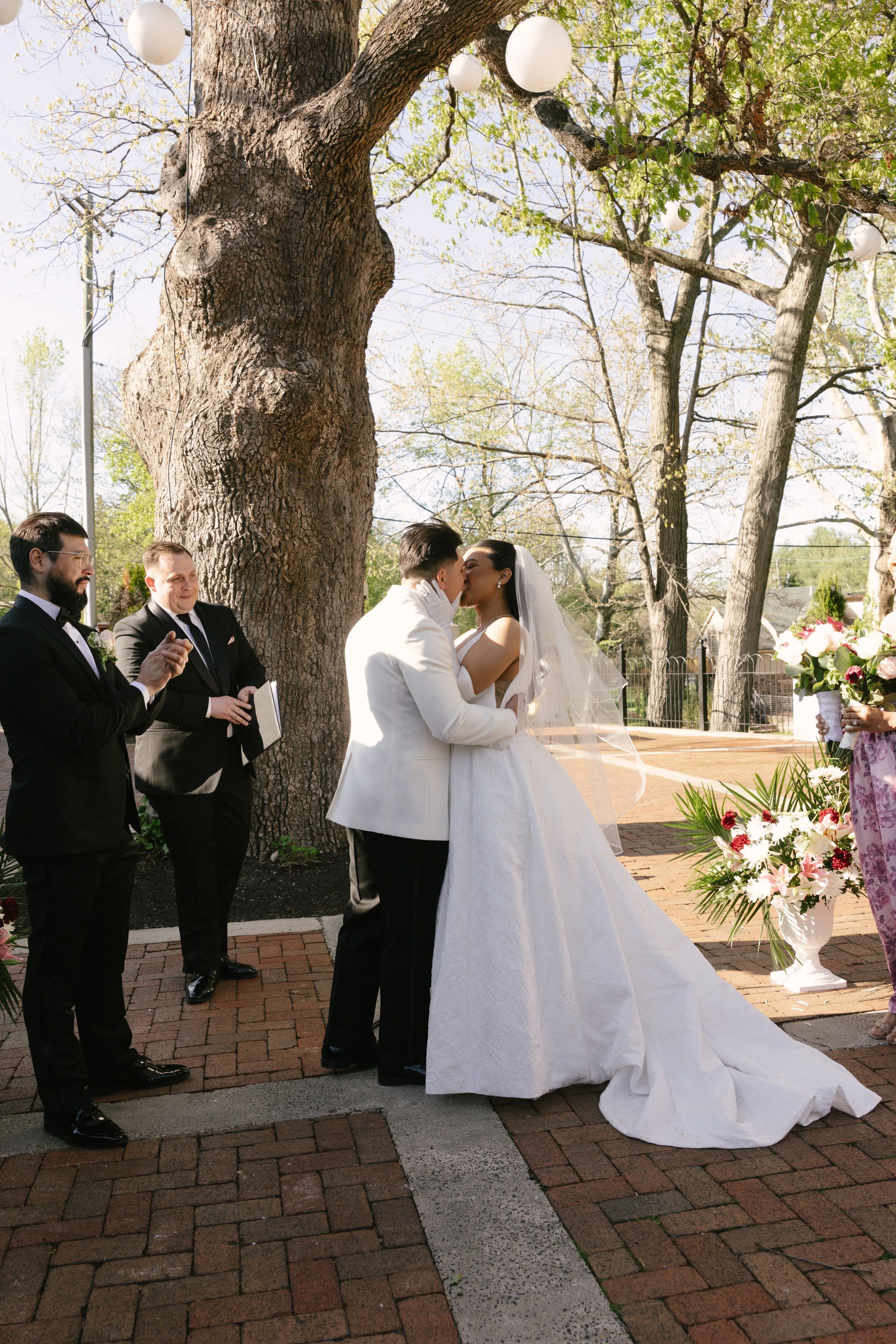 Outdoor wedding ceremony at Hotel DuVillage featuring the bride and groom, wedding party, and meaningful moments captured on both digital and 35mm film. A timeless celebration documented with a candid, documentary approach