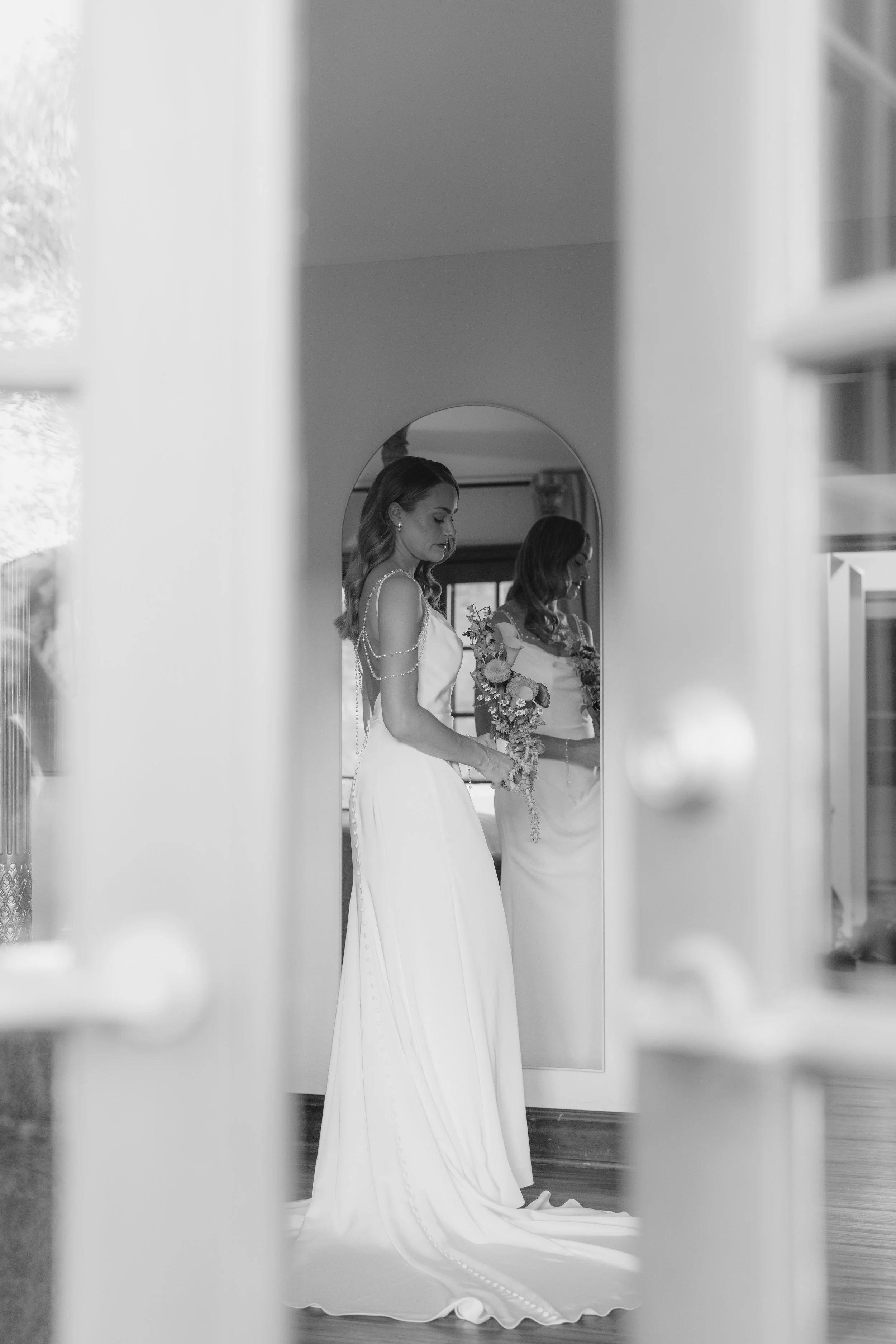 Chelsea and Travis' intimate Sedona elopement continued with heartfelt bridal getting-ready moments as the bride shared meaningful time with her mother and closest loved ones. From fastening her wedding dress and adding the finishing touches to quiet