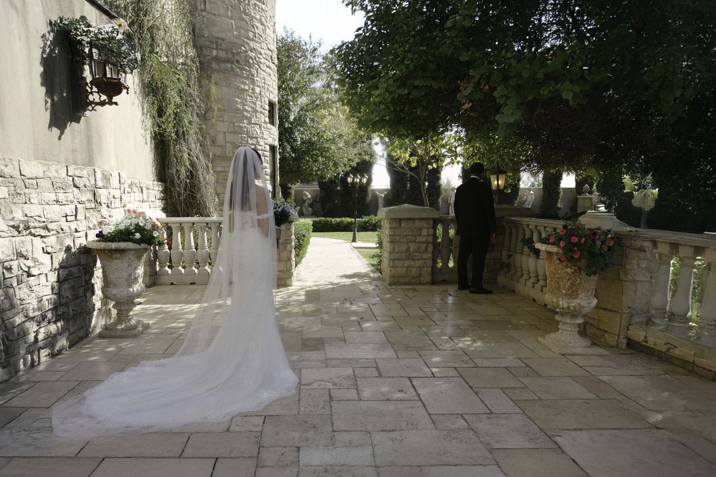 The bride’s first look with her father at Ashley Castle in Chandler, Arizona, was a heartfelt and emotional moment, beautifully documented through hybrid film and digital photography to preserve the joy, love, and anticipation shared before the cerem