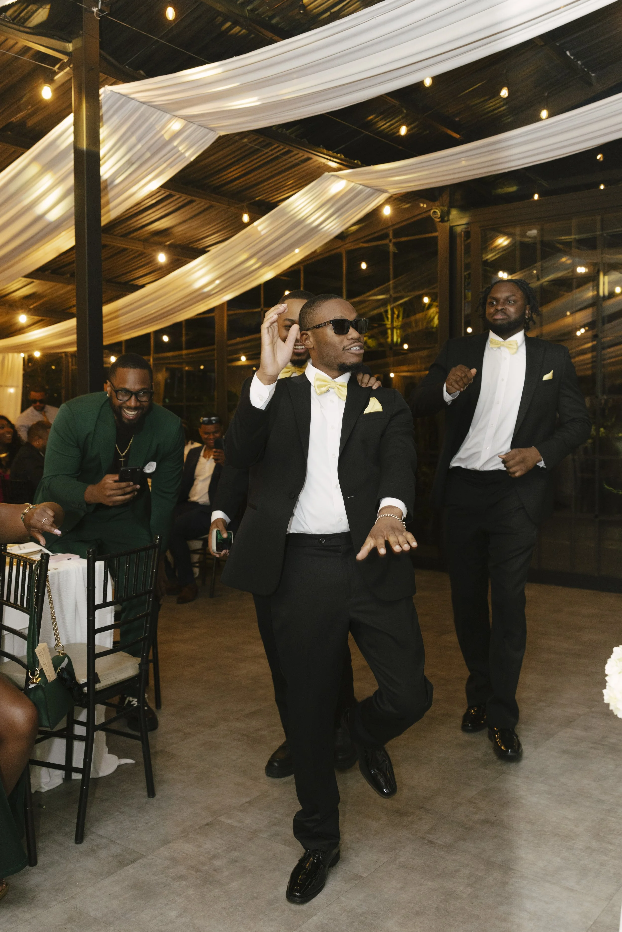Wedding reception details at Forest Campestre in Medellín, Colombia featuring elegant reception décor, floral tablescapes, wedding cake, custom signage, first dance, and lively celebration captured through documentary wedding photography