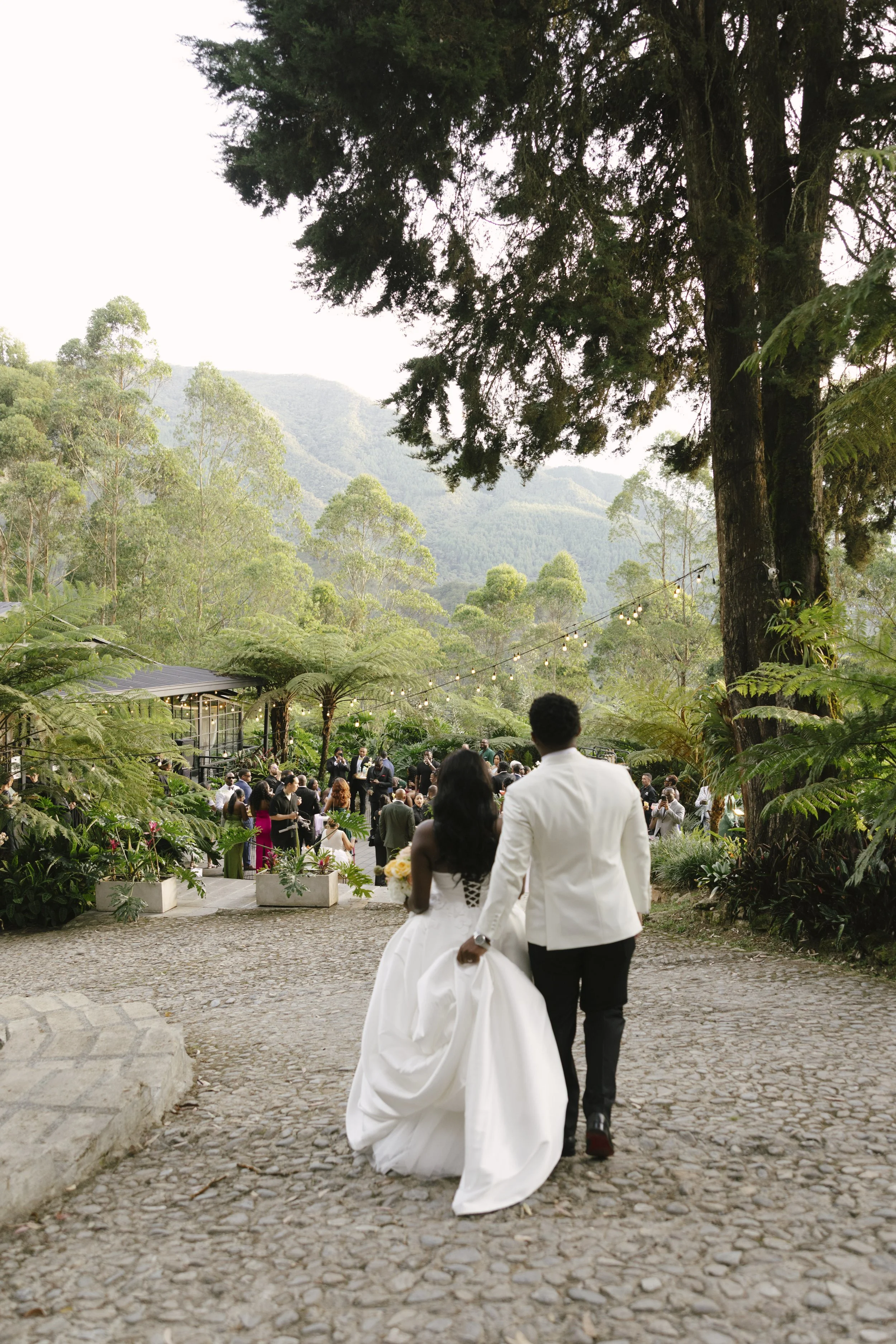  Bride and groom portraits at Forest Campestre in Medellín, Colombia featuring romantic destination wedding photography, lush tropical gardens, bridal party portraits, and natural, documentary-style moments.