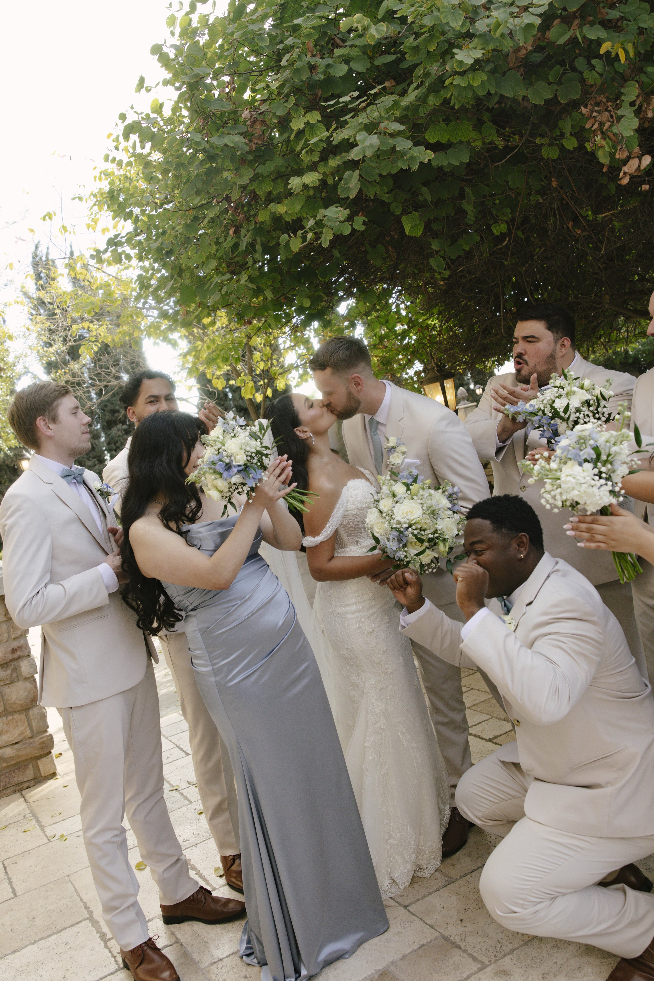 The bridal party portraits at Ashley Castle in Chandler, Arizona, brought playful energy and celebration to the day, with hybrid film and digital photography capturing candid laughter, stylish group moments, and unforgettable memories with the bride,