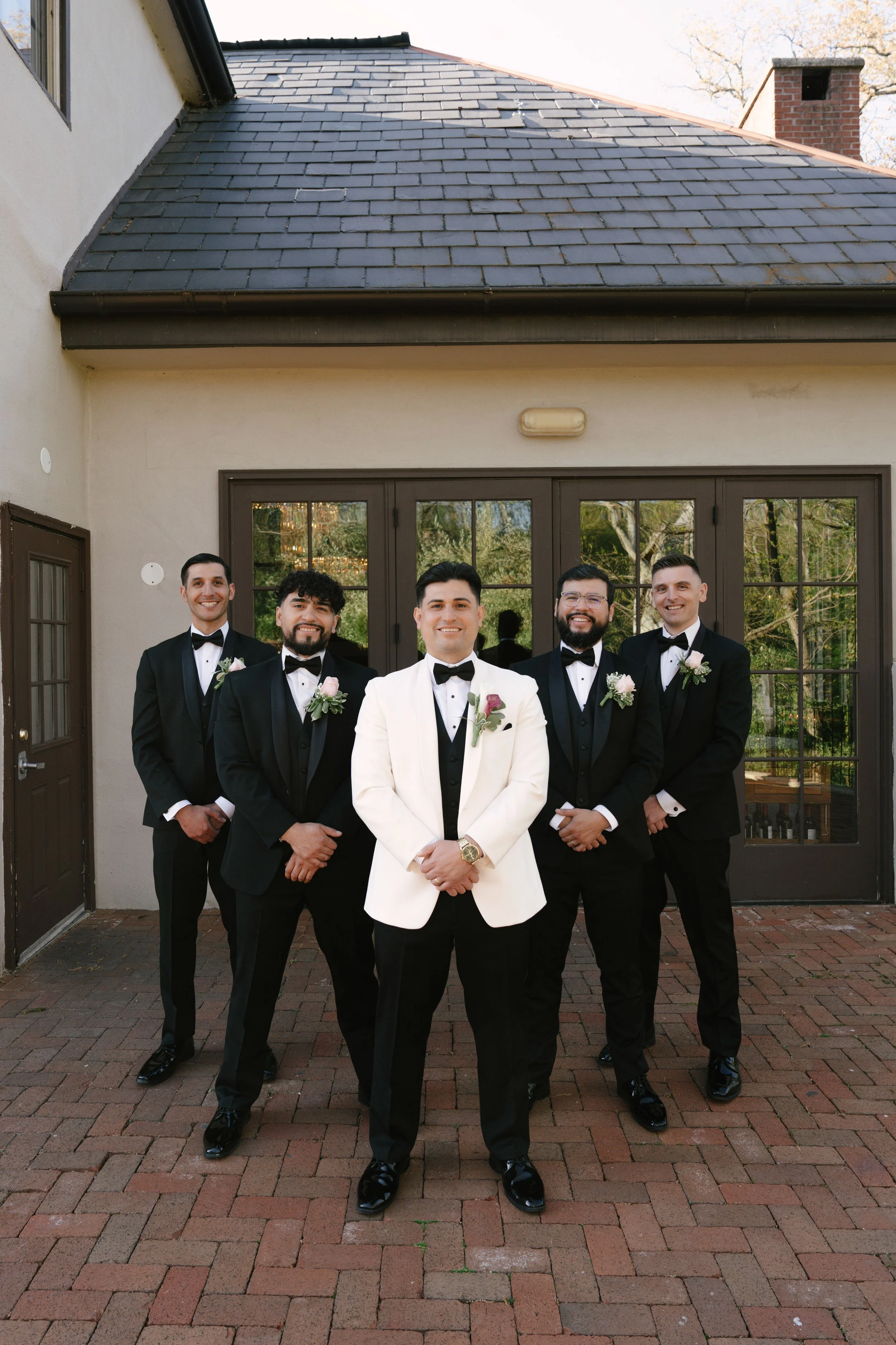 Bridal party portraits at Hotel DuVillage celebrate the bride and groom alongside their closest friends and family. Captured on digital and 35mm film, these images highlight genuine laughter, timeless portraits, and unforgettable moments.
