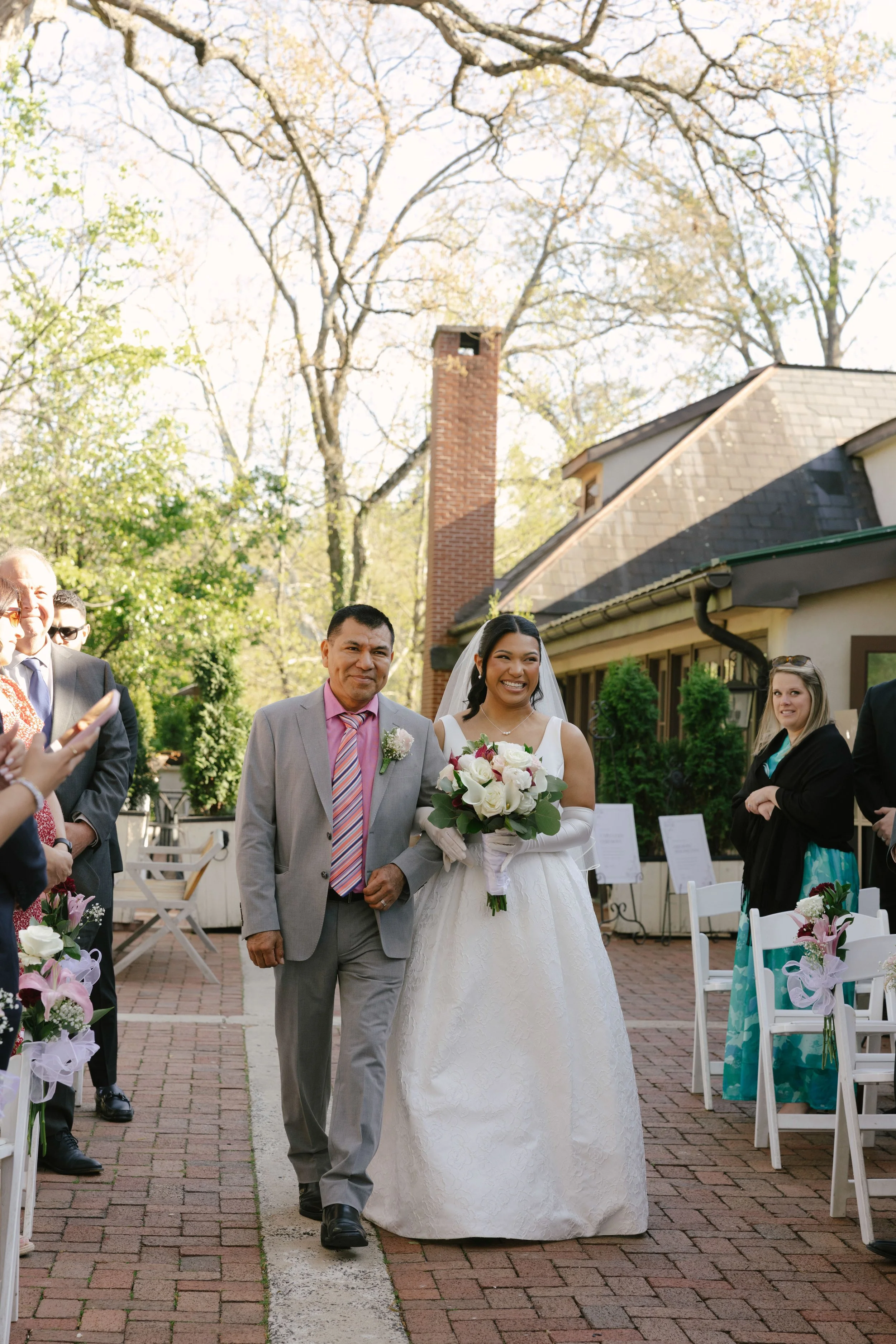 Outdoor wedding ceremony at Hotel DuVillage featuring the bride and groom, wedding party, and meaningful moments captured on both digital and 35mm film. A timeless celebration documented with a candid, documentary approach