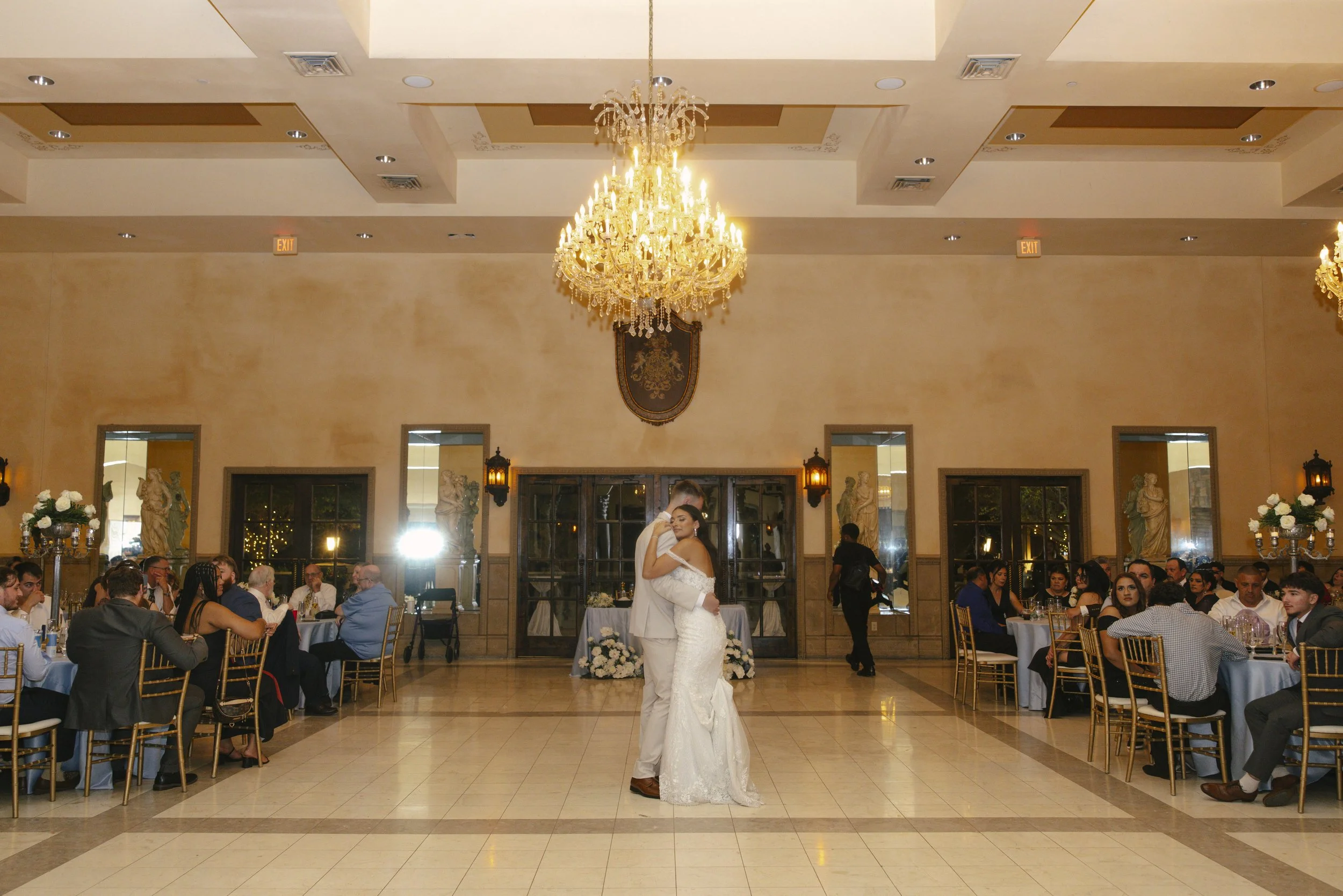 The reception celebration at Ashley Castle in Chandler, Arizona, came to life through hybrid film and digital photography, capturing elegant reception details, joyful bridal party entrances, and lively dance floor moments inside the castle’s grand ba