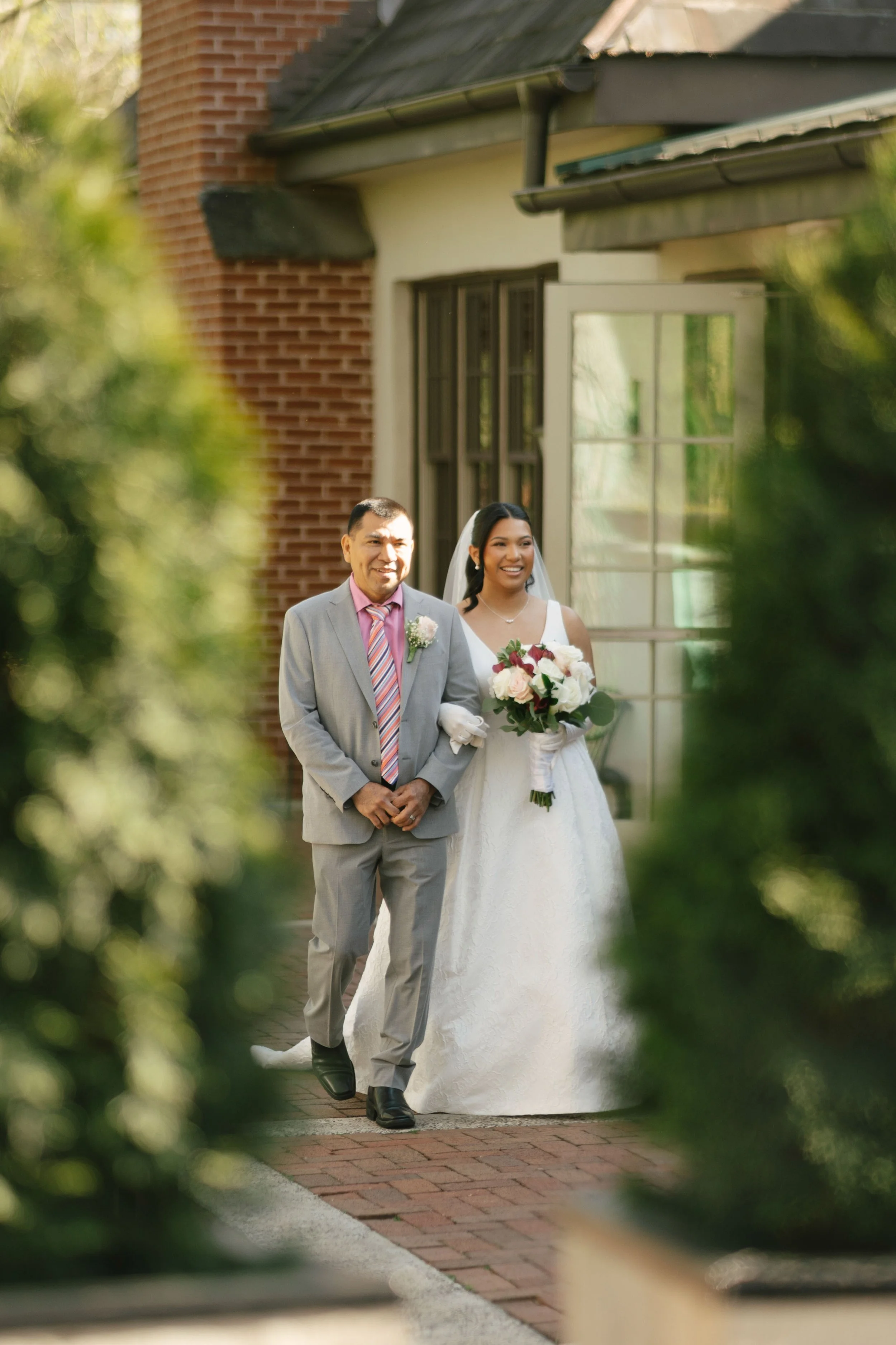 Outdoor wedding ceremony at Hotel DuVillage featuring the bride and groom, wedding party, and meaningful moments captured on both digital and 35mm film. A timeless celebration documented with a candid, documentary approach