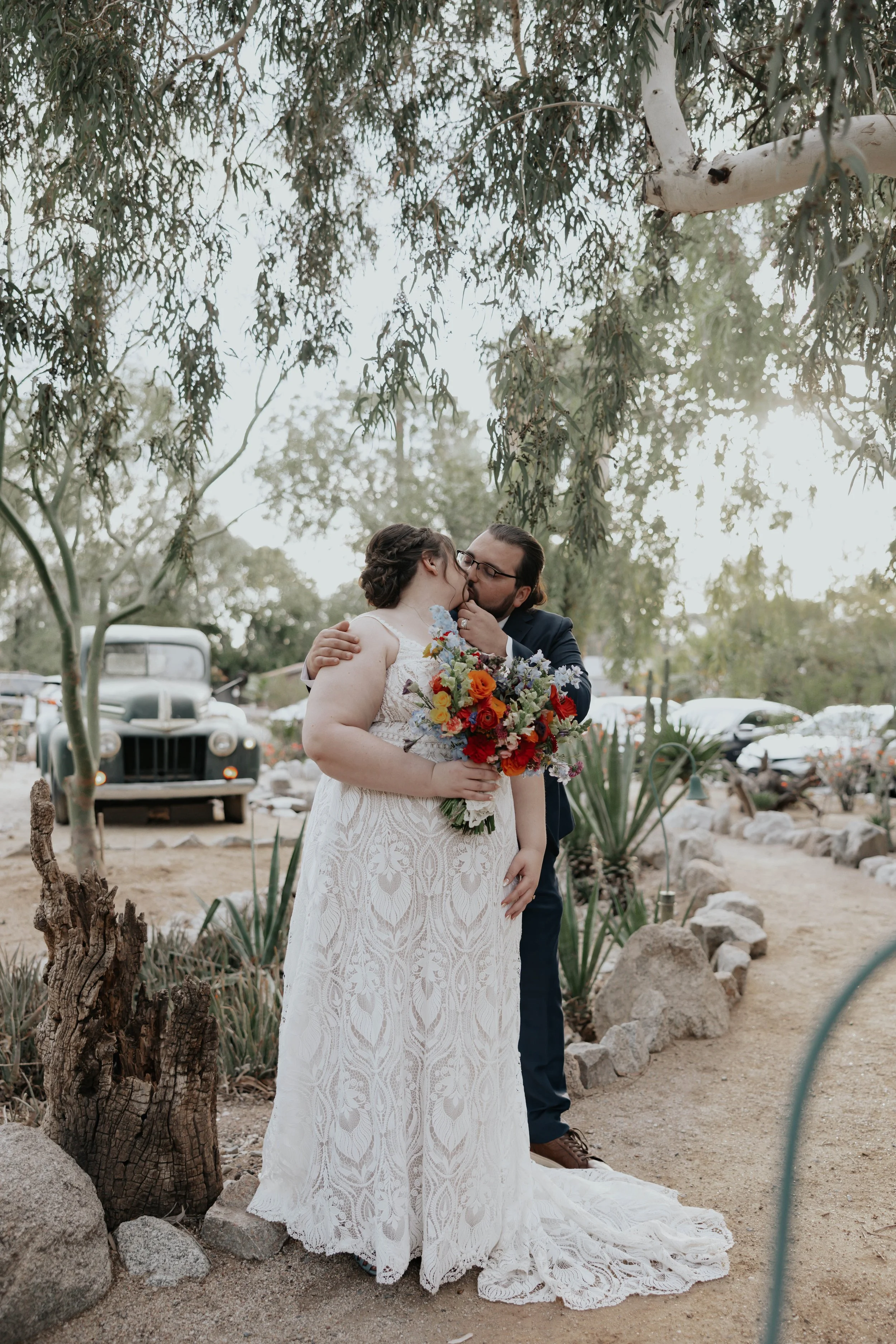 After the ceremony, Lauren and Joel explored the beautiful garden paths and adobe architecture of the Boojum Tree for their wedding portraits. Surrounded by desert greenery and warm Phoenix light, these moments captured the joy and excitement of thei
