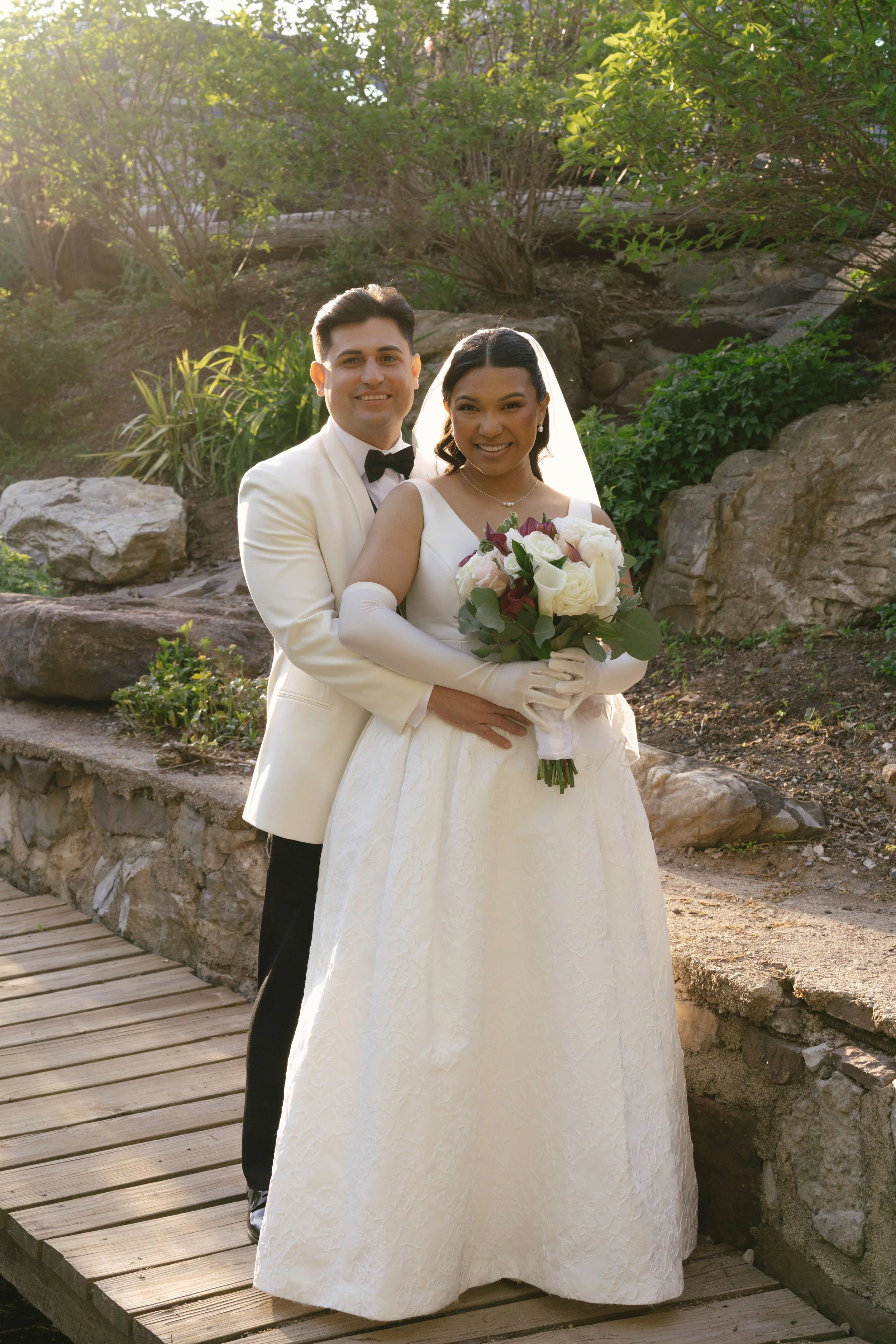 Bride and groom portraits at Hotel DuVillage showcase the venue's picturesque gardens, waterfront views, and timeless charm. Photographed on both digital and 35mm film, these wedding portraits focus on authentic connection, natural movement, and cand