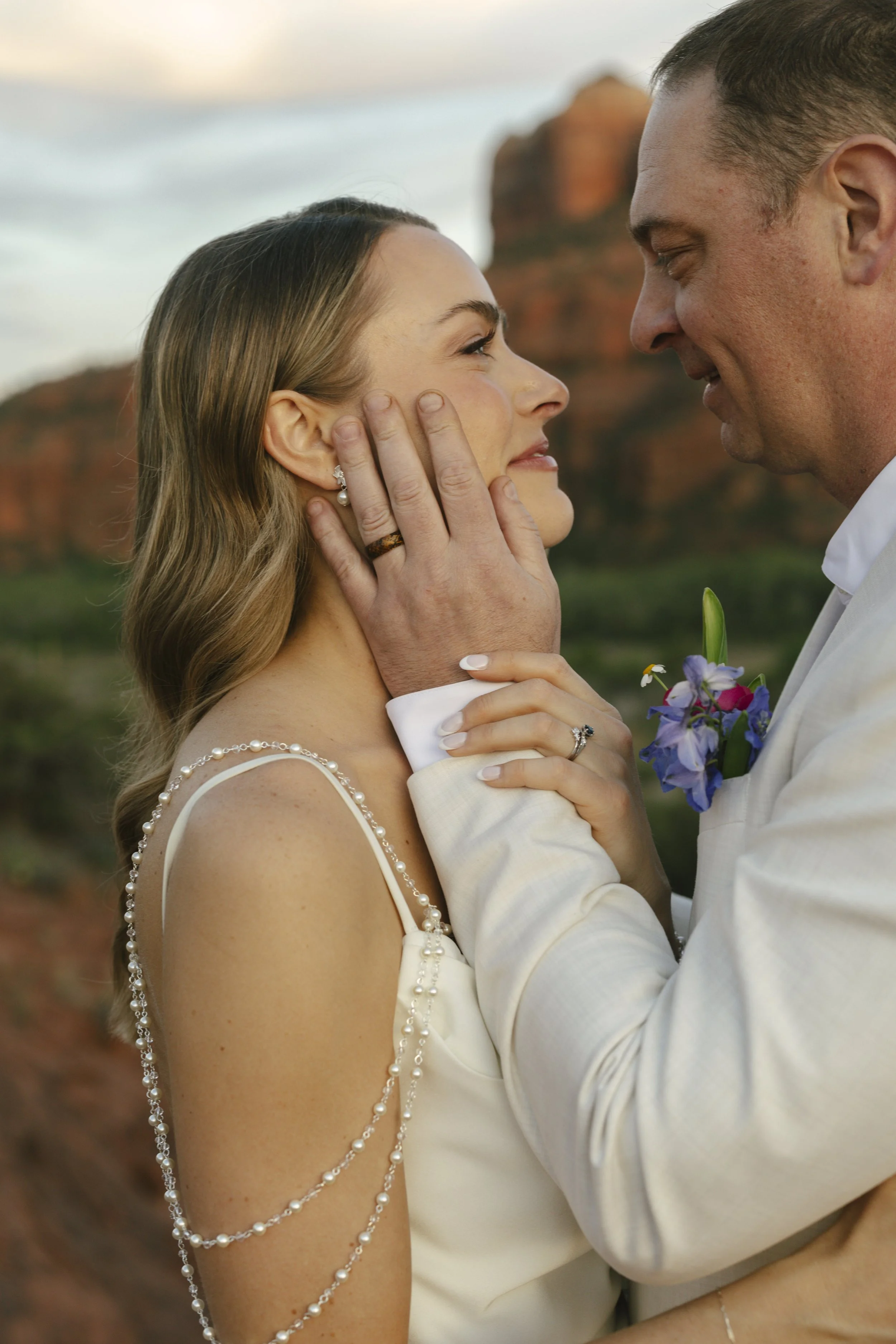 Romantic golden hour portraits at Secret Slick Rock during Chelsea and Travis' intimate Sedona elopement. Featuring Sedona's famous red rock views, stunning Arizona desert landscapes, and timeless wedding photography, these newlywed portraits perfect